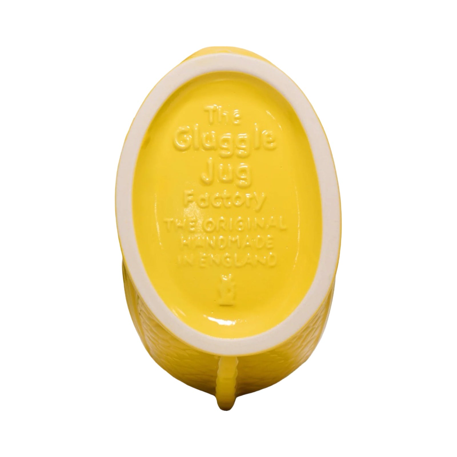 A yellow fish shaped gluggle jug.