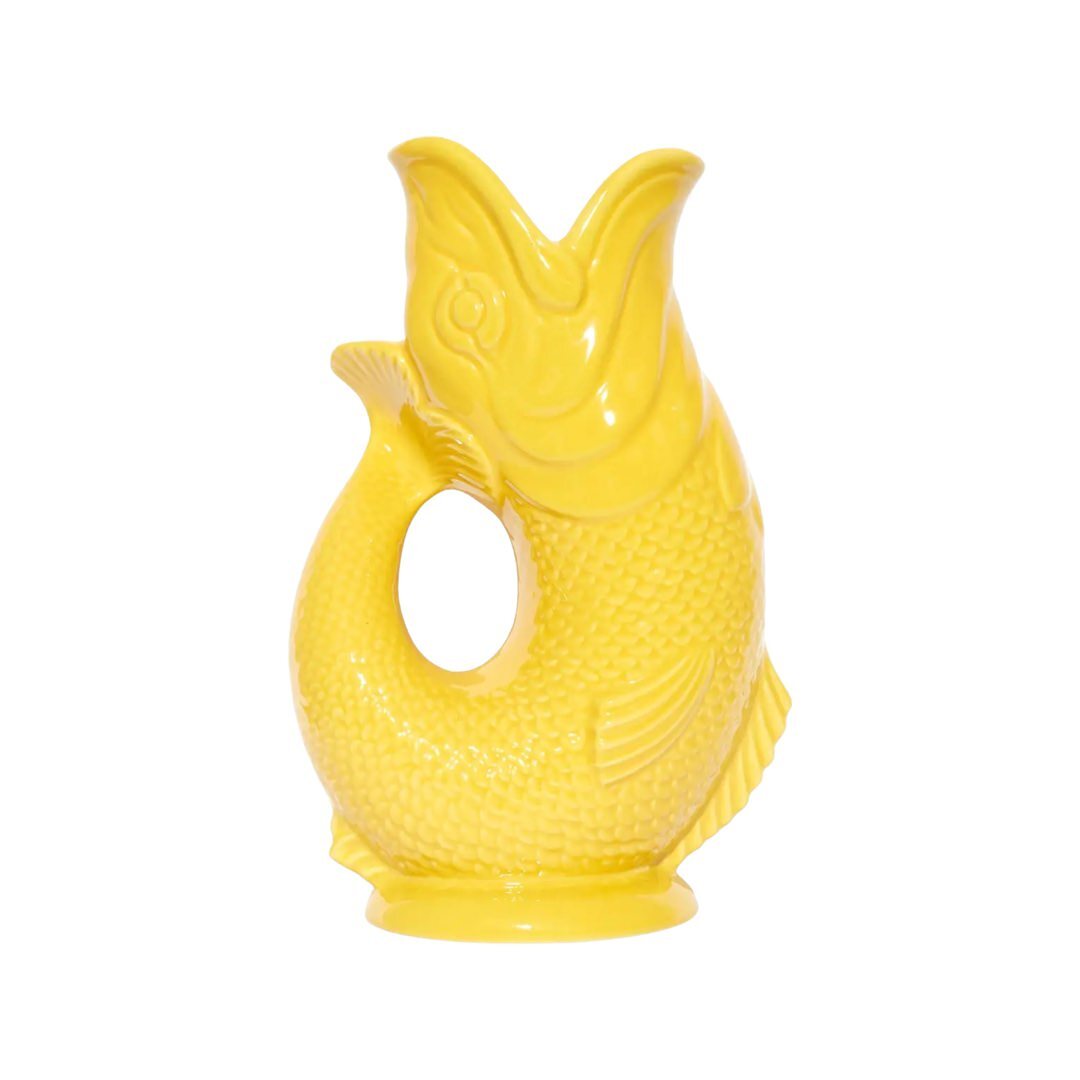 A yellow fish shaped gluggle jug.
