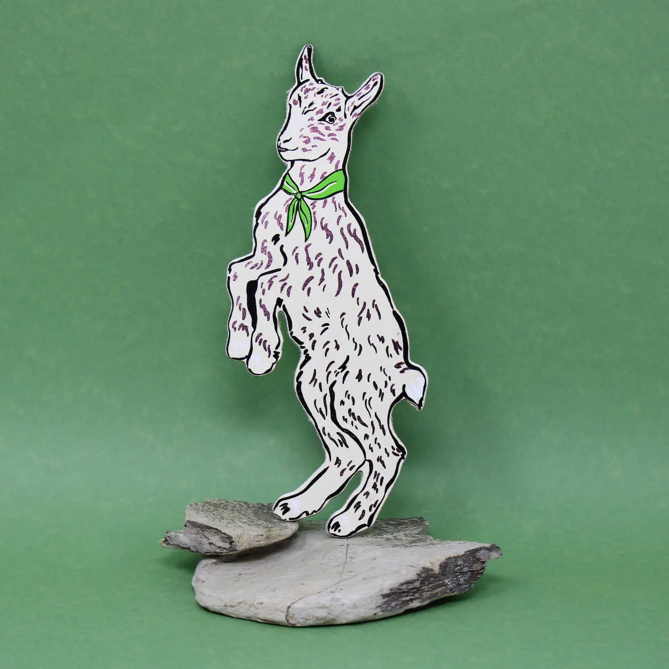 Decorative figurine of a goat with a necktie on a green background.