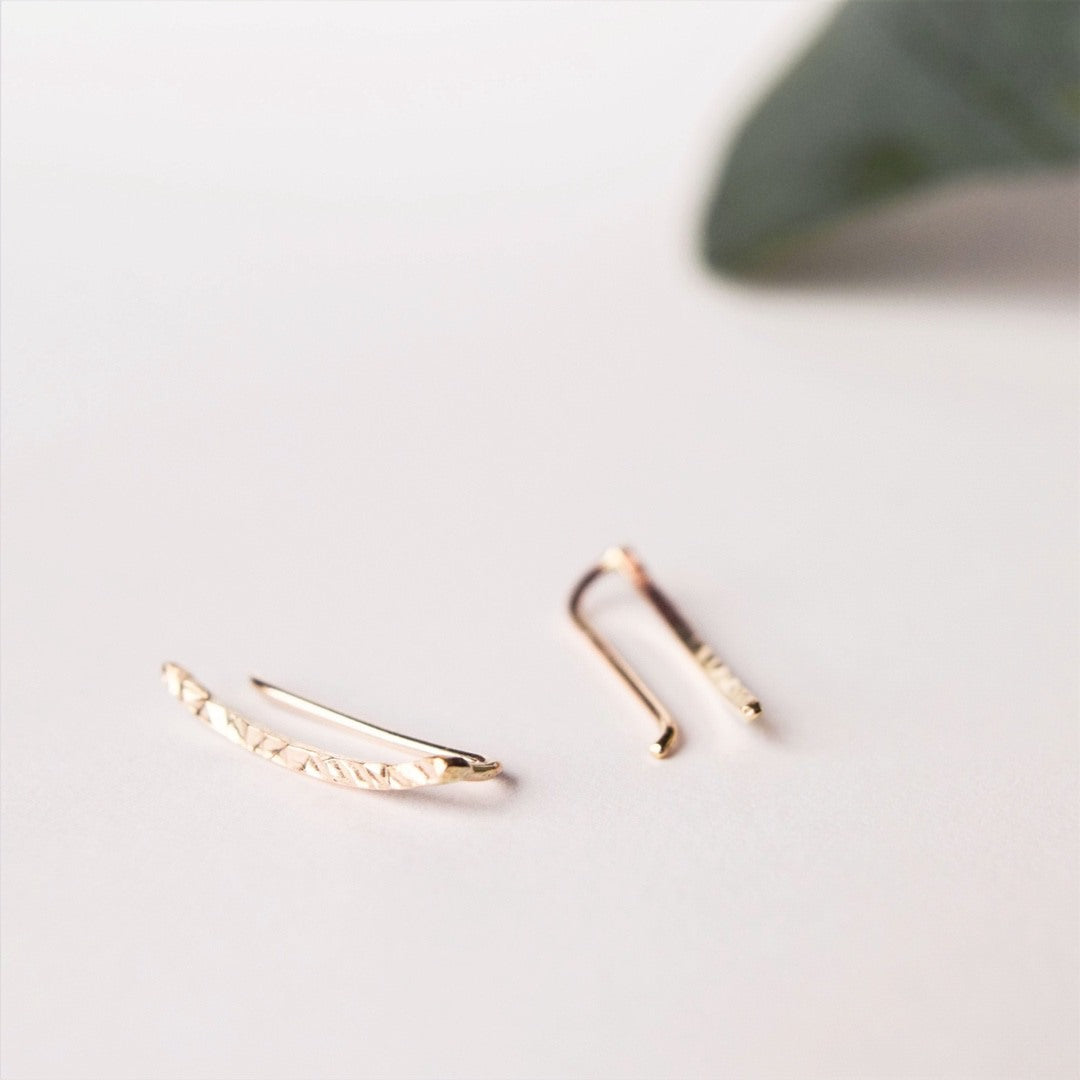 Elegant ear climbers with a subtle curve to follow the shape of your ear. Pinch to secure in place.