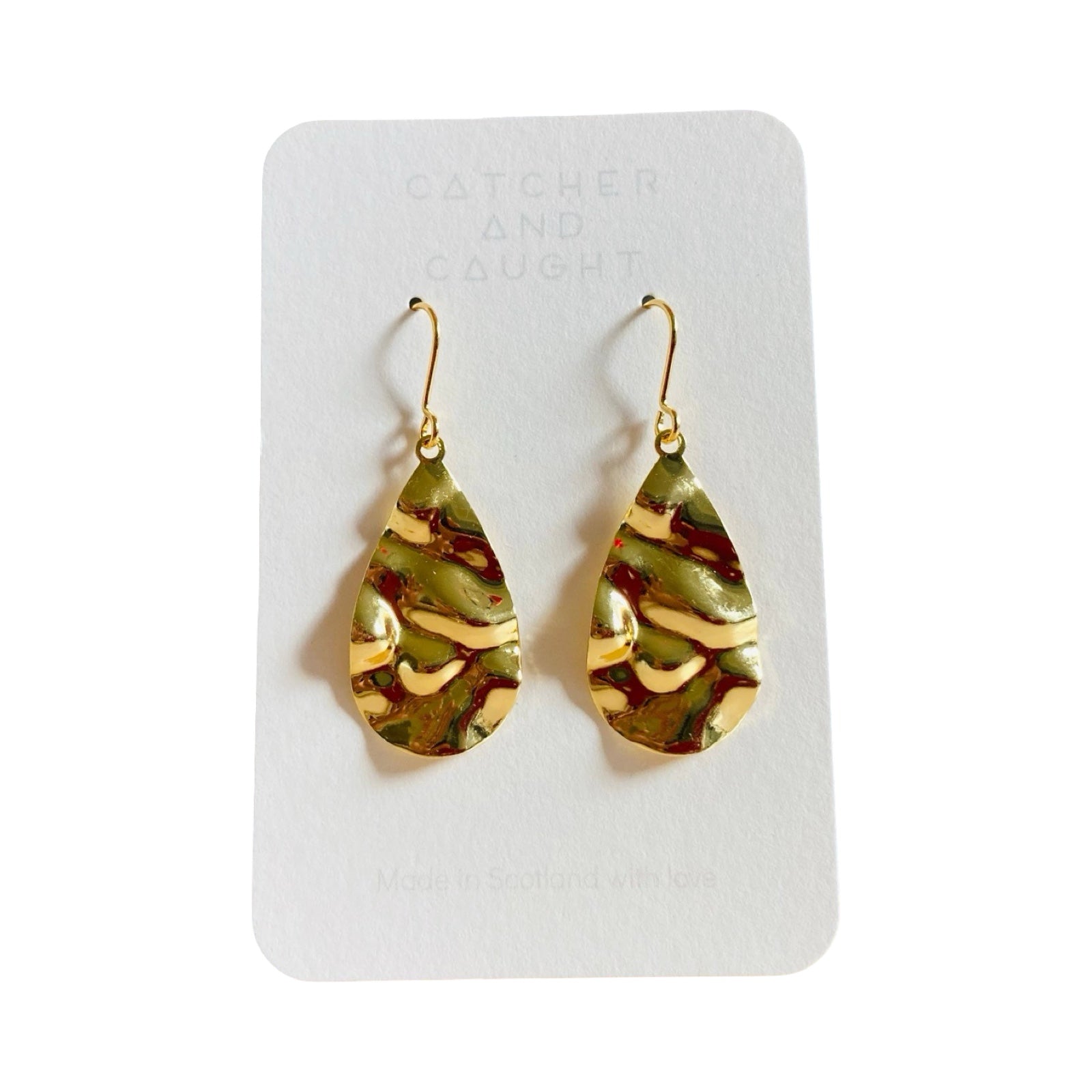 These gold-plated teardrop-shaped earrings are made from brushed brass on gold-plated earring hooks.
