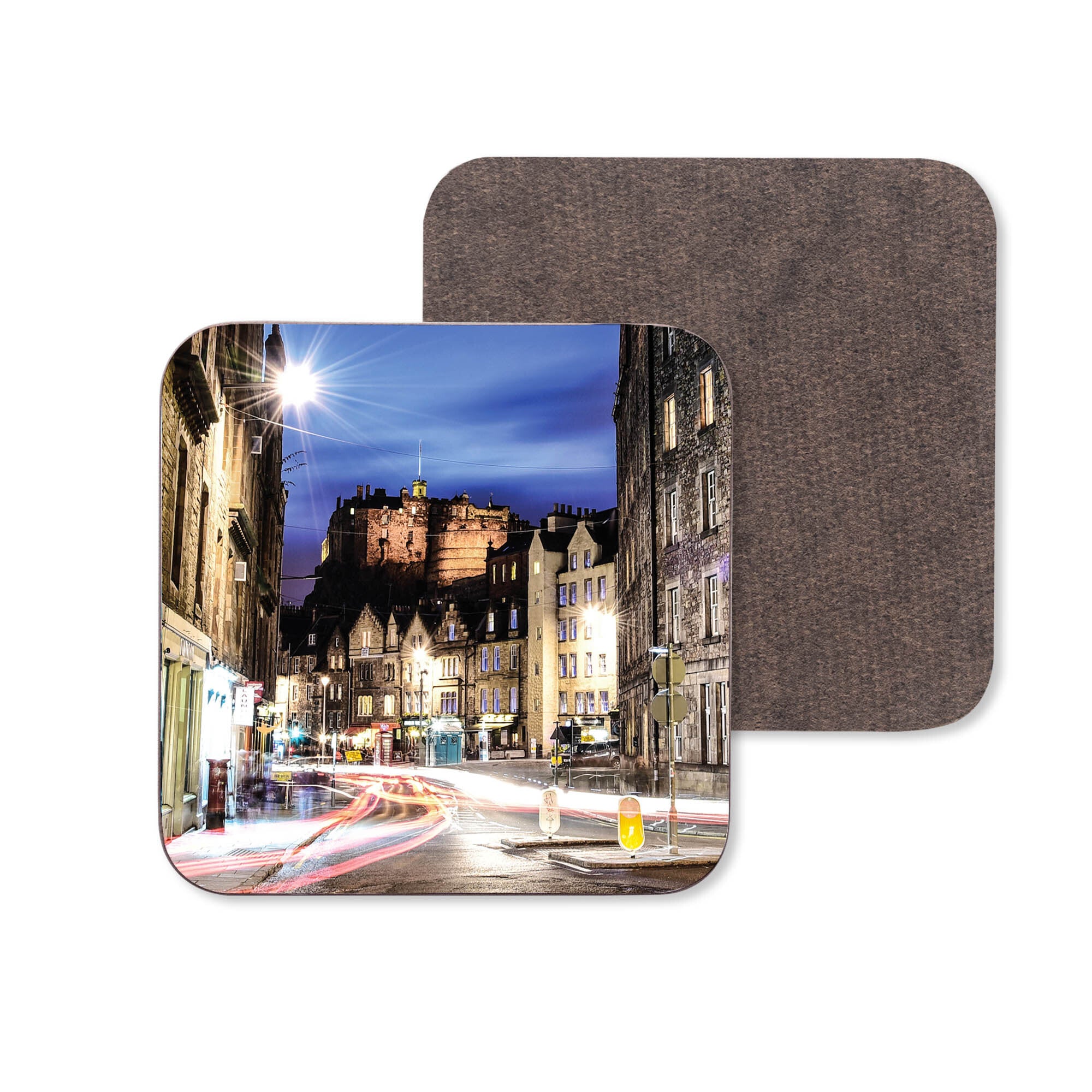 An image of Edinburgh Castle at night taken from Grassmarket on a coaster.
