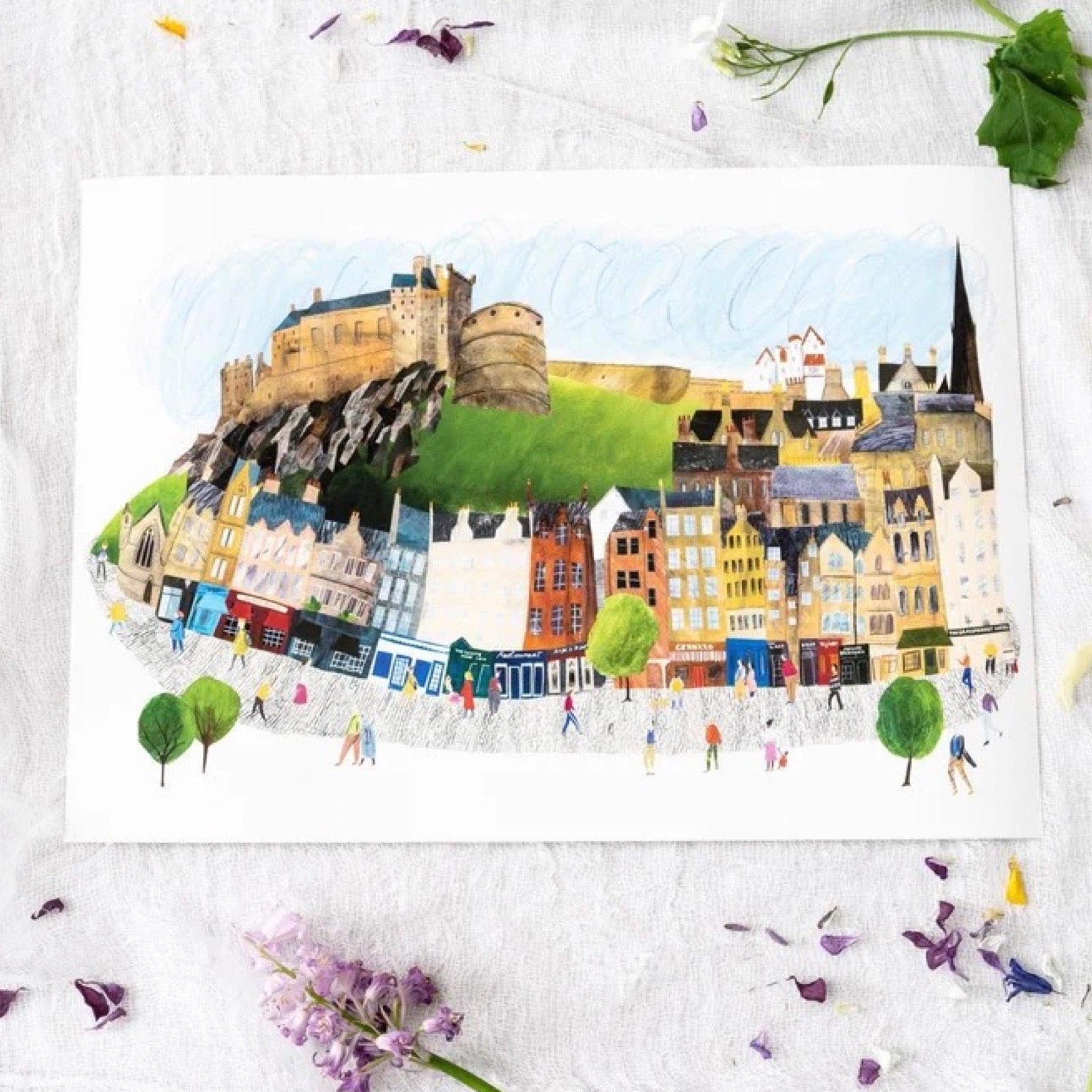 Illustration of Edinburgh castle on a white background with flowers scattered around.