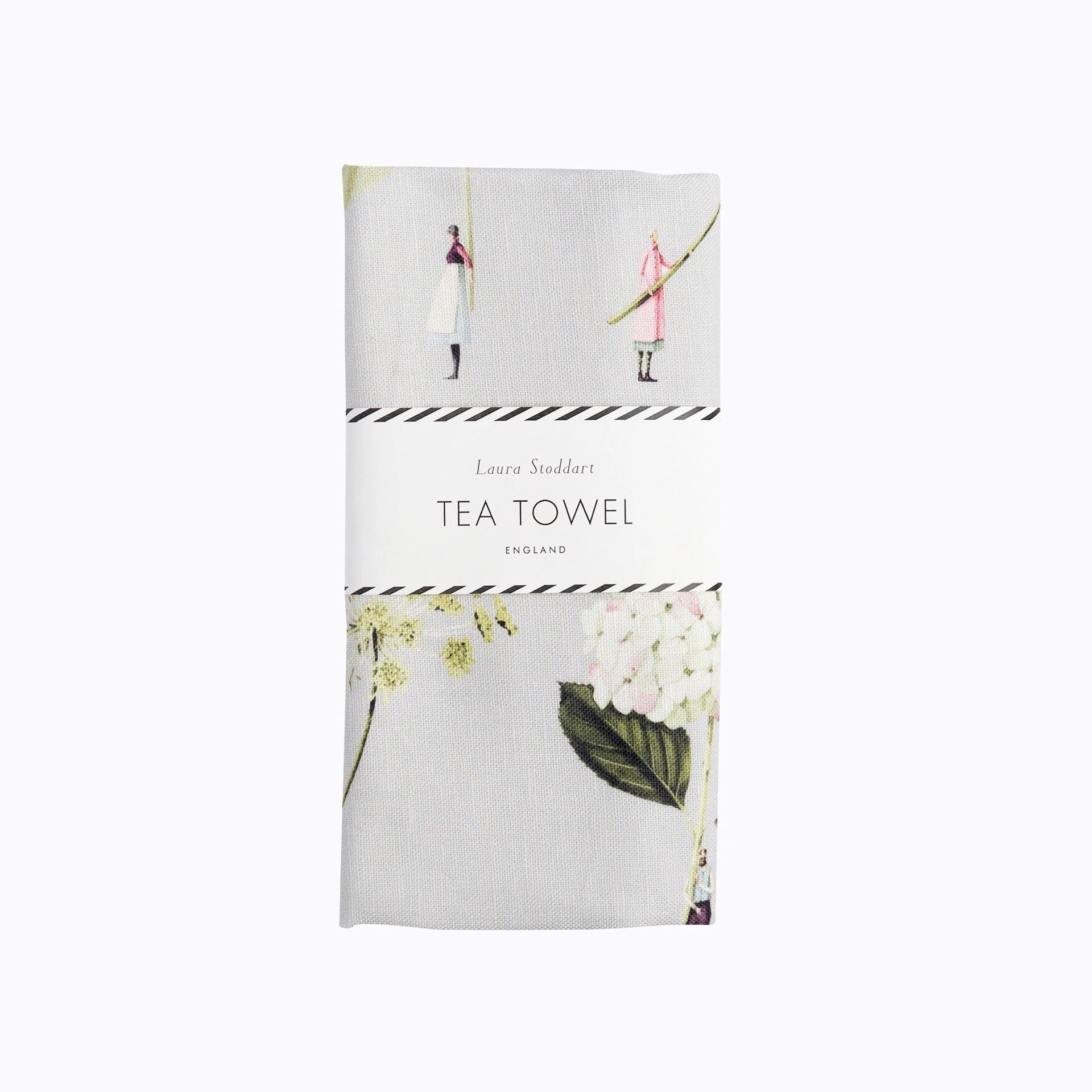 Folded tea towel featuring an illustration of giant hydrangea, hellebore, astrantia, and ammi flowers.