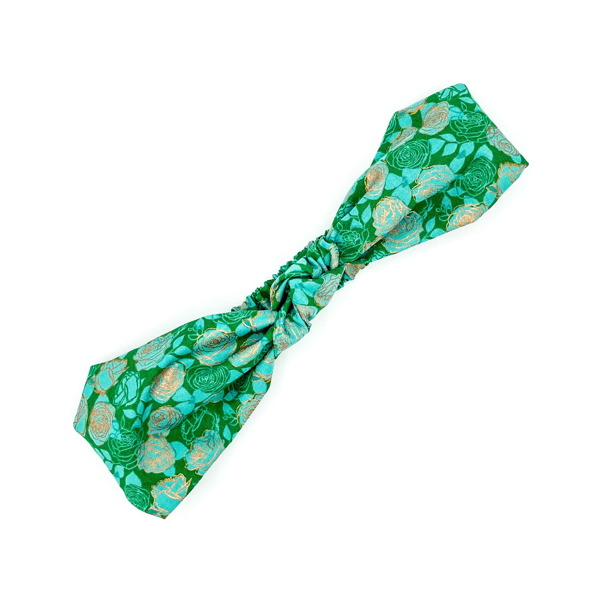 Handmade knotted headband in 100% green cotton rose fabric.