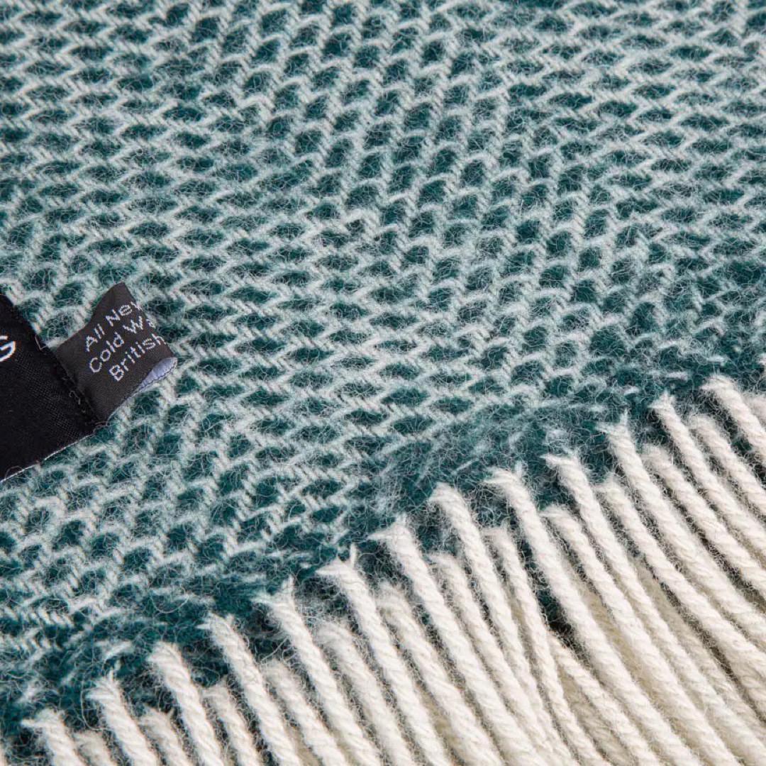 This grey and green striped super cosy and fluffy blanket is made from 100% pure new wool and finished with extra brushing to make it super soft.