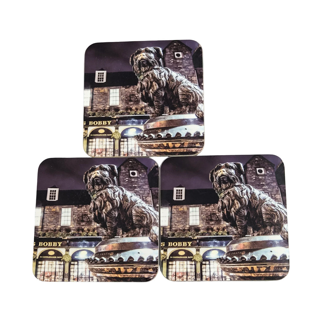 Set of three coasters with a dog and building design on a white background