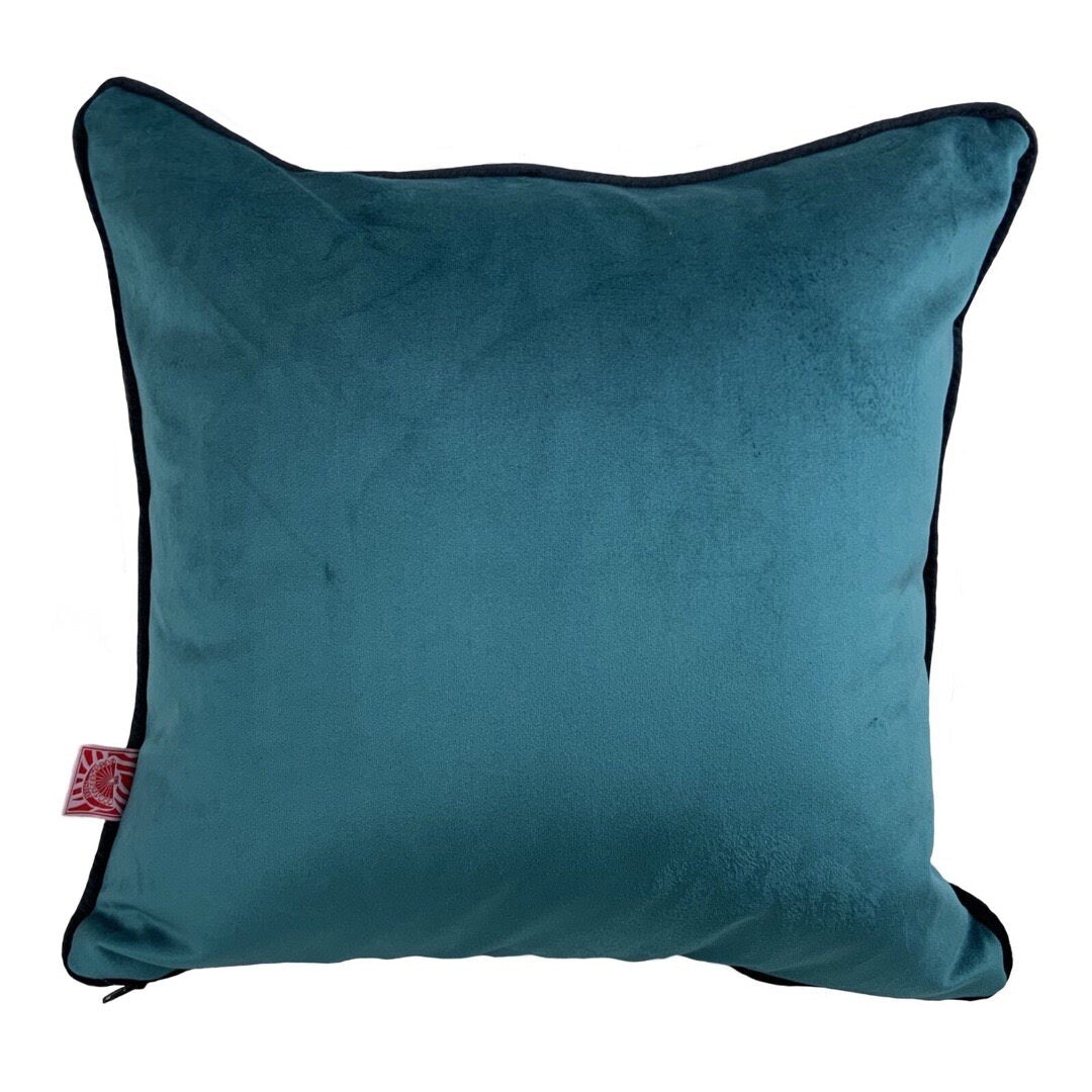 Turquoise velvet back of groovy face cushion yellow.