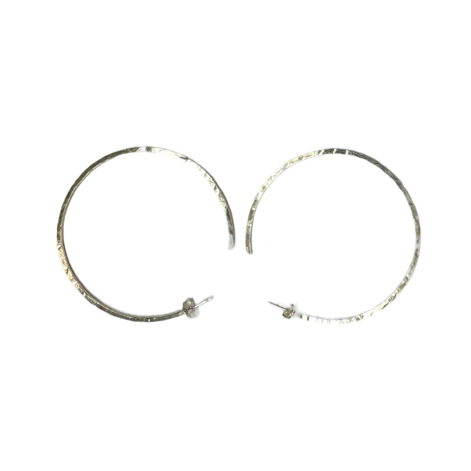 Silver hoop earrings made from recycled sterlings silver and given a slight beaten texture.