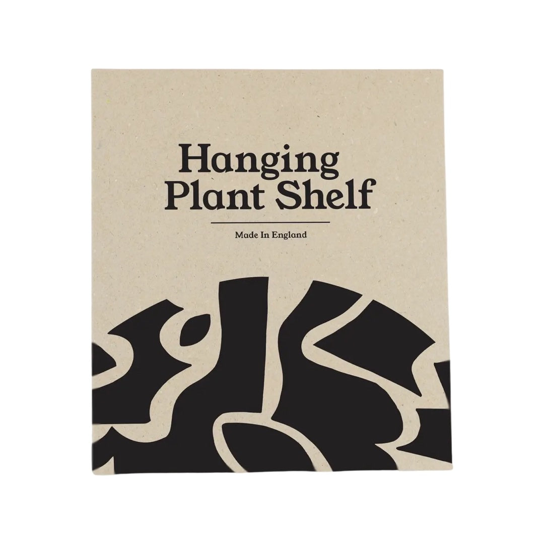The box for a hanging plant shelf in black.
