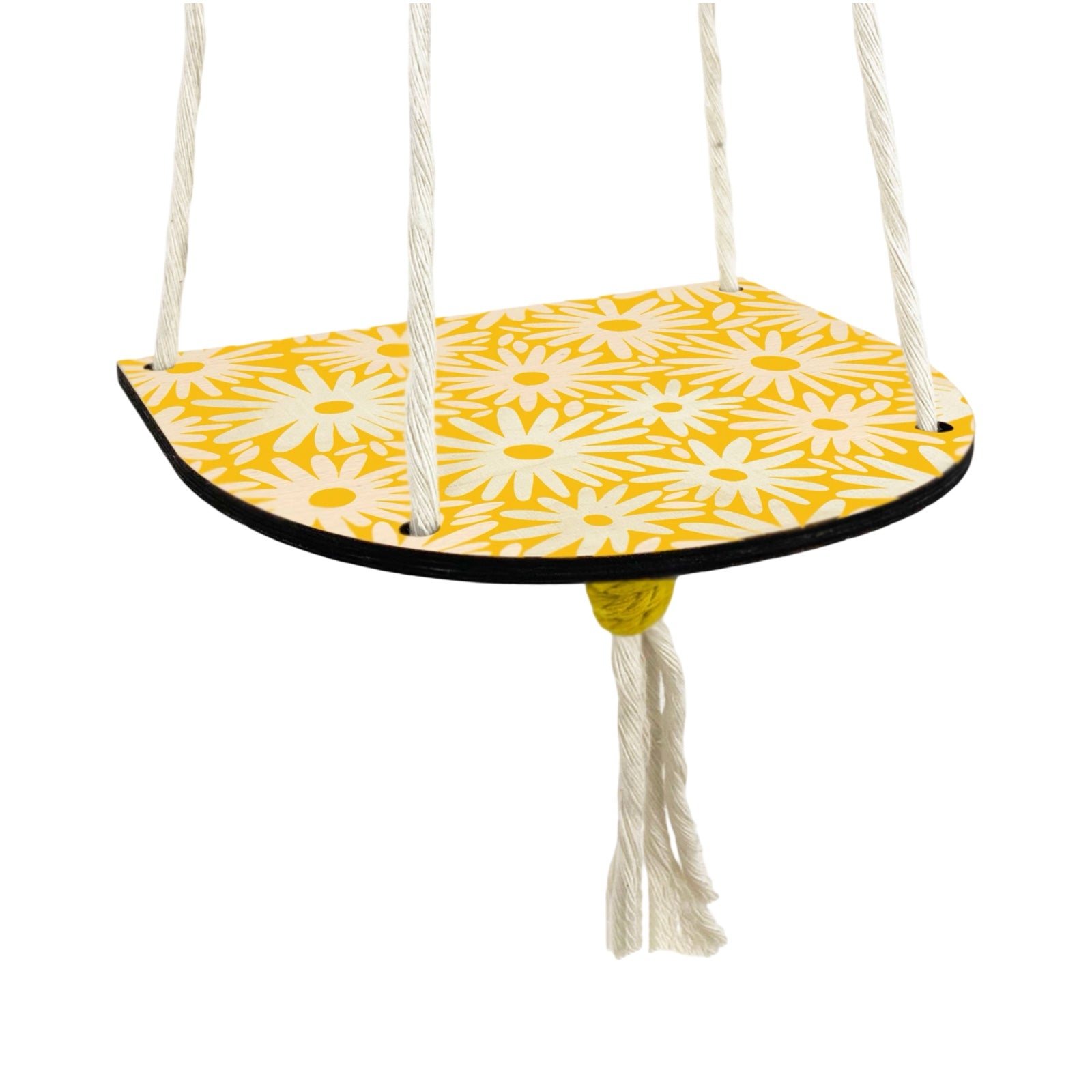 A yellow and white floral wood shelf hanging on 4 strings of rope that sits against the wall.