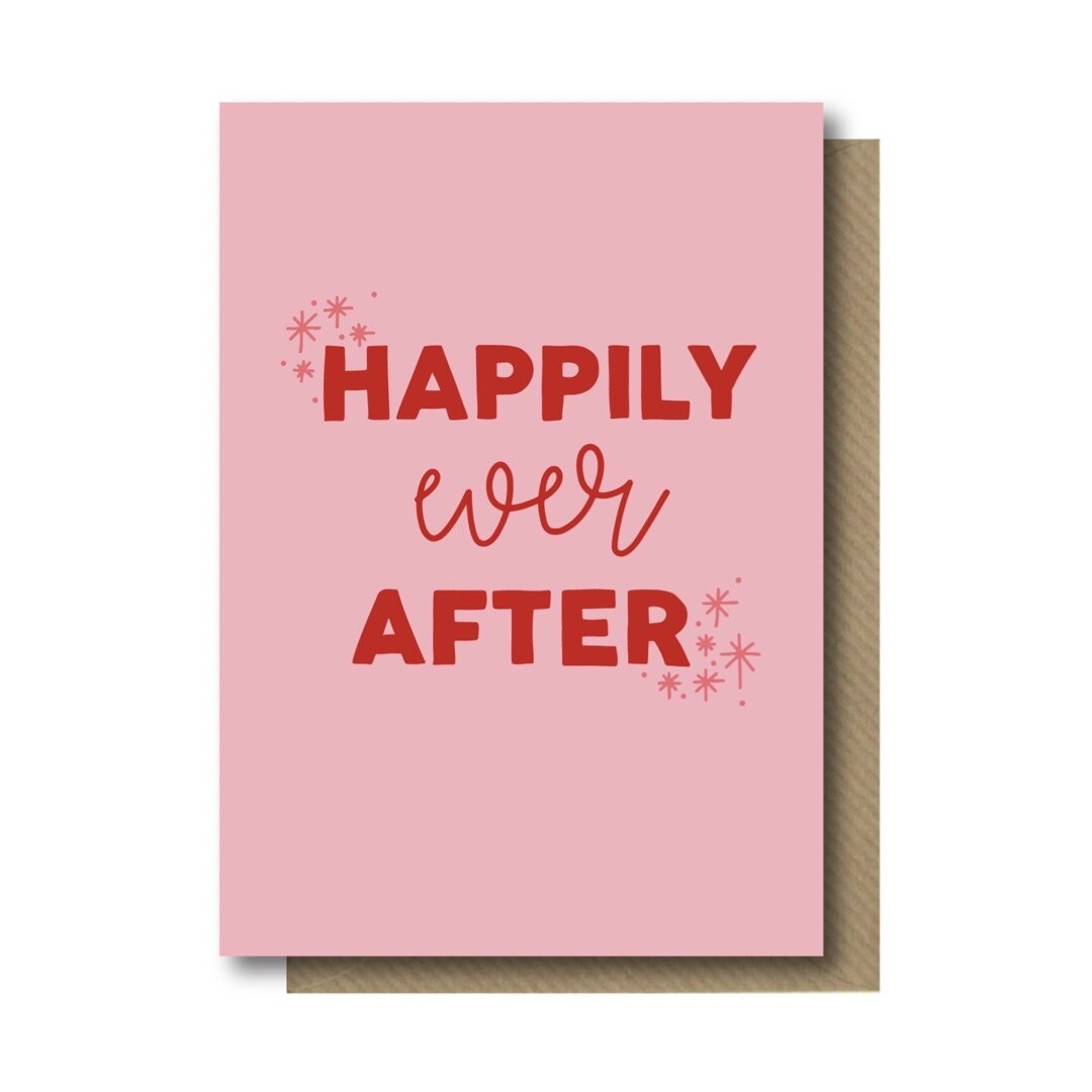 Wedding card with the text 'Happily Ever After' in red lettering against a pink background.