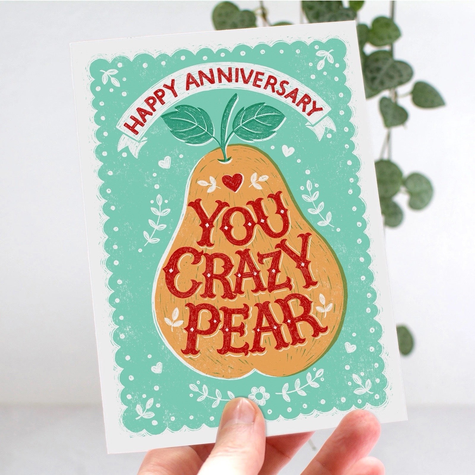 Card with a pear illustration and 'Happy Anniversary, You Crazy Pear' text on a light green background.