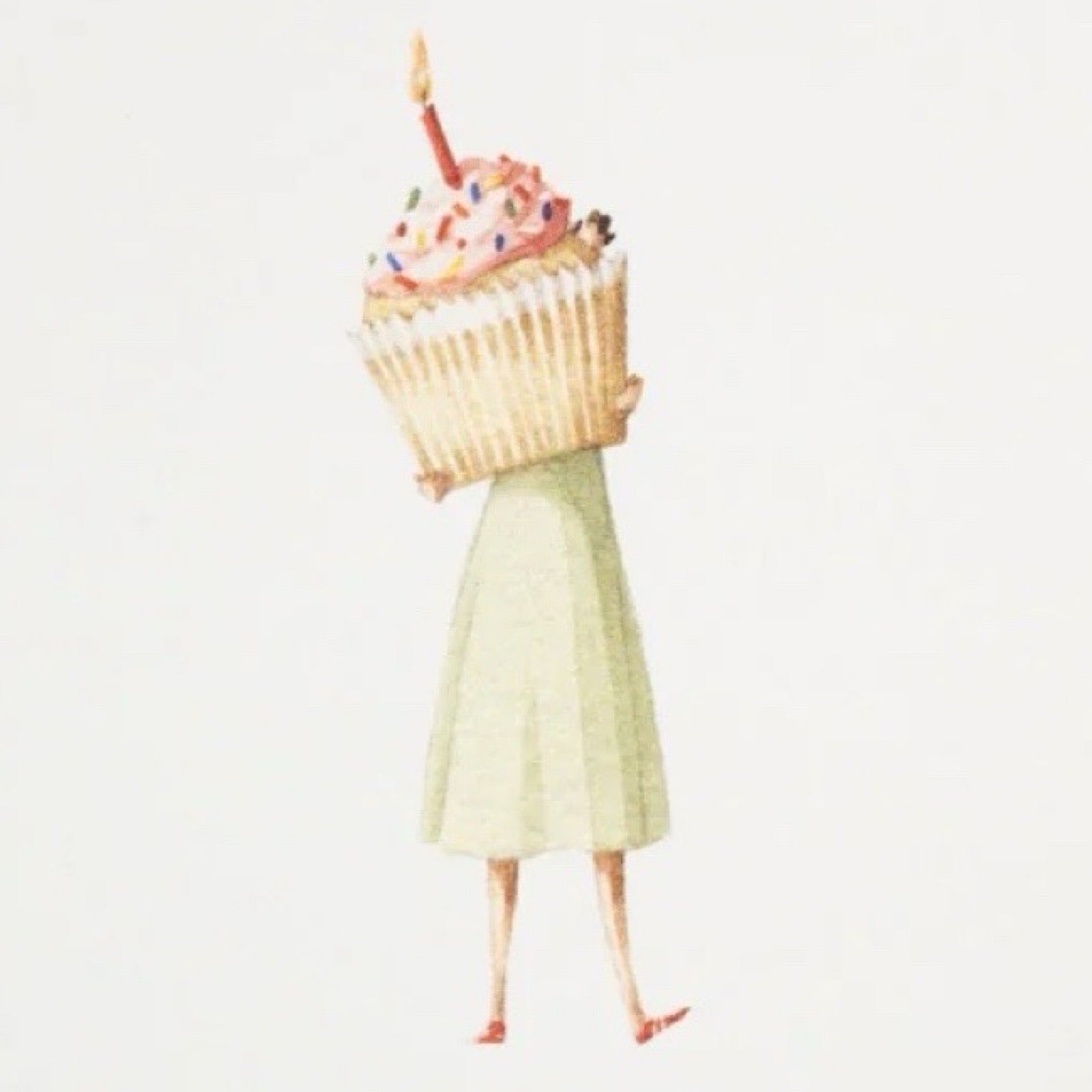 Person wearing a dress holding a large cupcake on a white background.