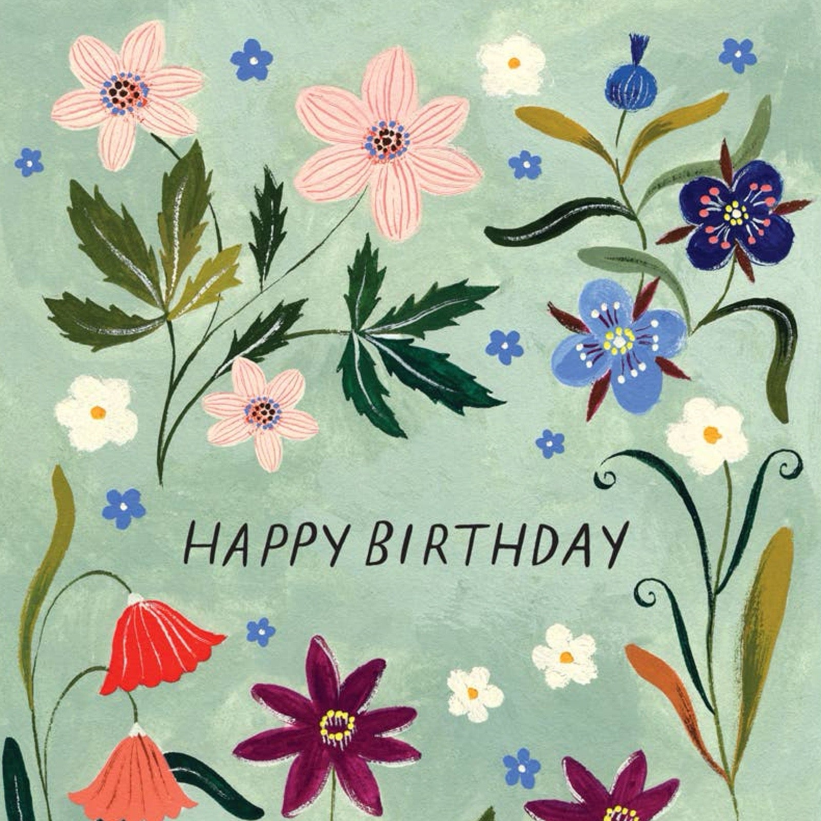 A floral greeting card design with the words “HAPPY BIRTHDAY” in dark lettering on a pale mint-green background. The card is decorated with hand-painted style flowers in pink, blue, white, red, and purple, along with green leaves and dark vine-like flourishes.