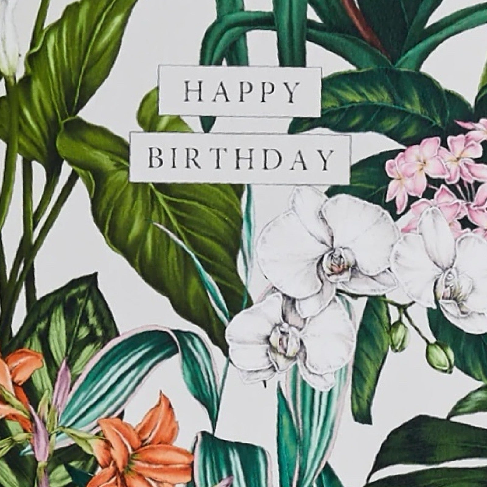 Floral design with 'Happy Birthday' card.