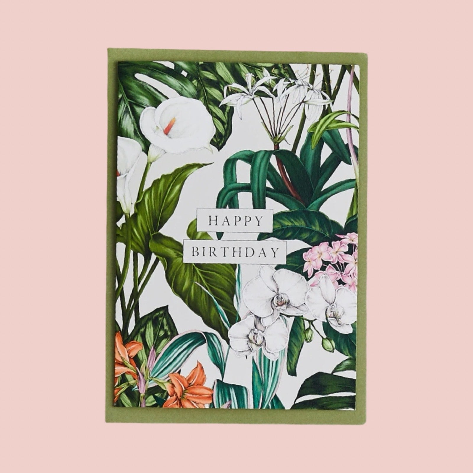 Floral birthday card with green envelope on a pink background.