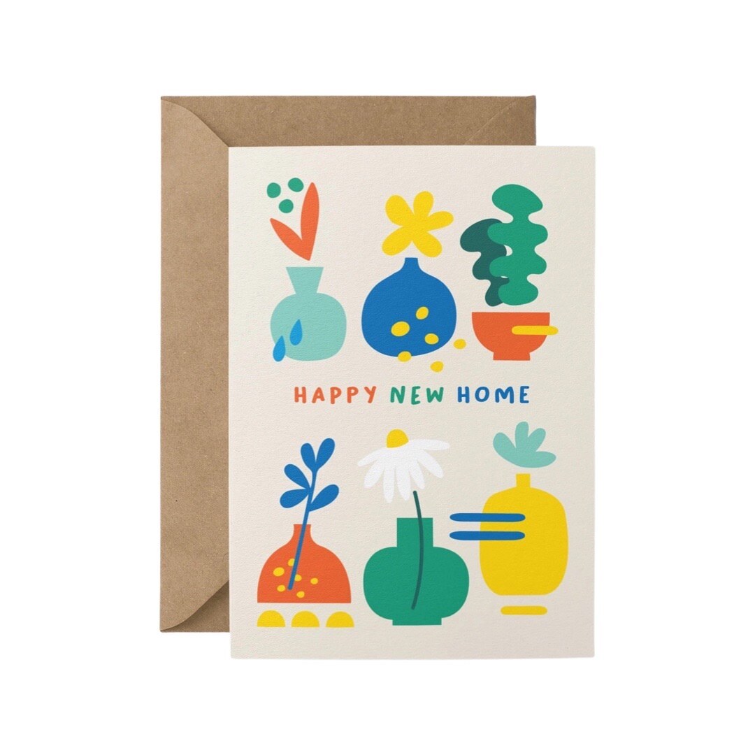 New home card featuring five colourful vases of flowers and a potted plant against a cream background and the text 'Happy New Home'.