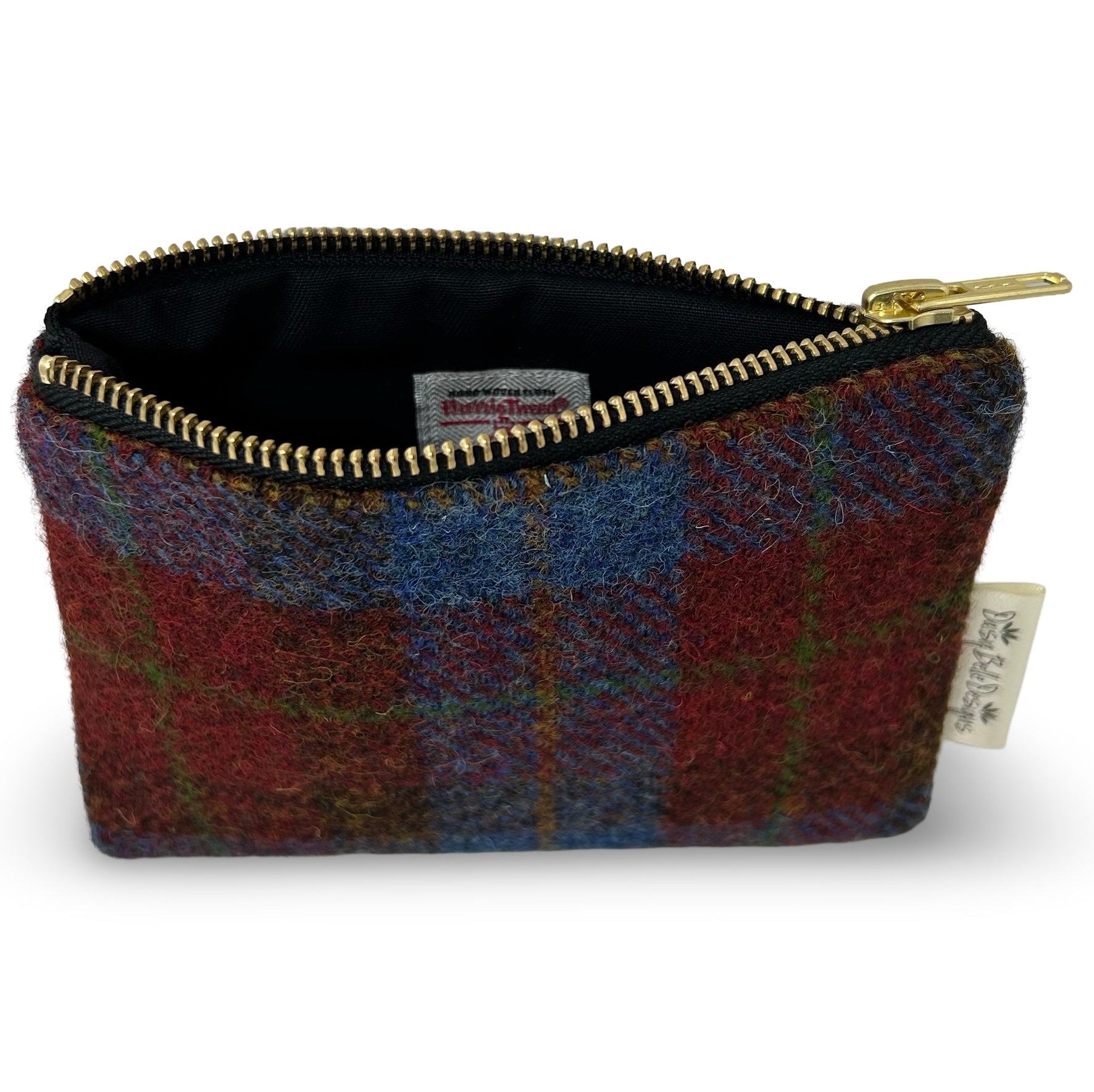 Rectangular Harris tweed purse in navy blue and burgundy check. Showing the Harris tweed Orb label sewn into the inner lining.