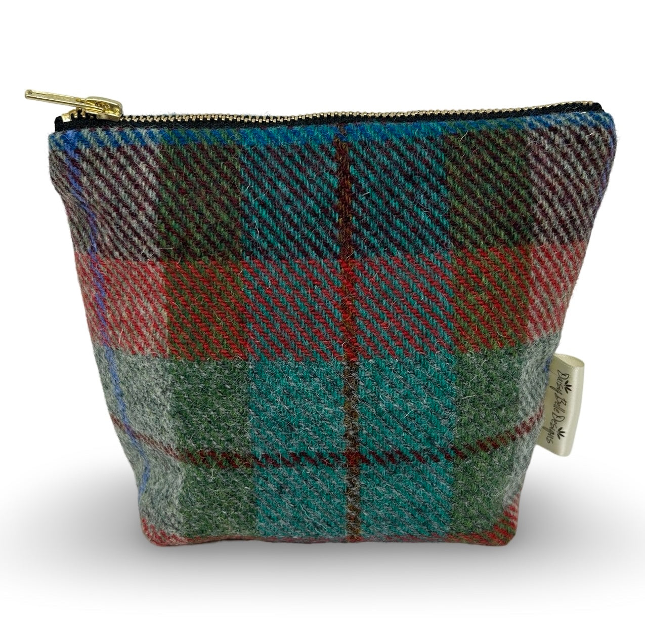 Toiletry bag in red and green check Harris tweed with a gold zip.