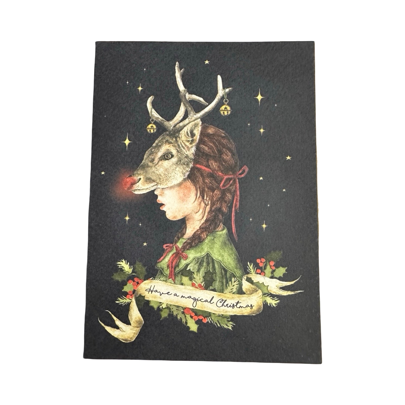 A gorgeous Christmas card of a girl wearing a Rudolph mask, dressed in a green dress. The text 'Have A magical Christmas' is written in a cream banner underneath.