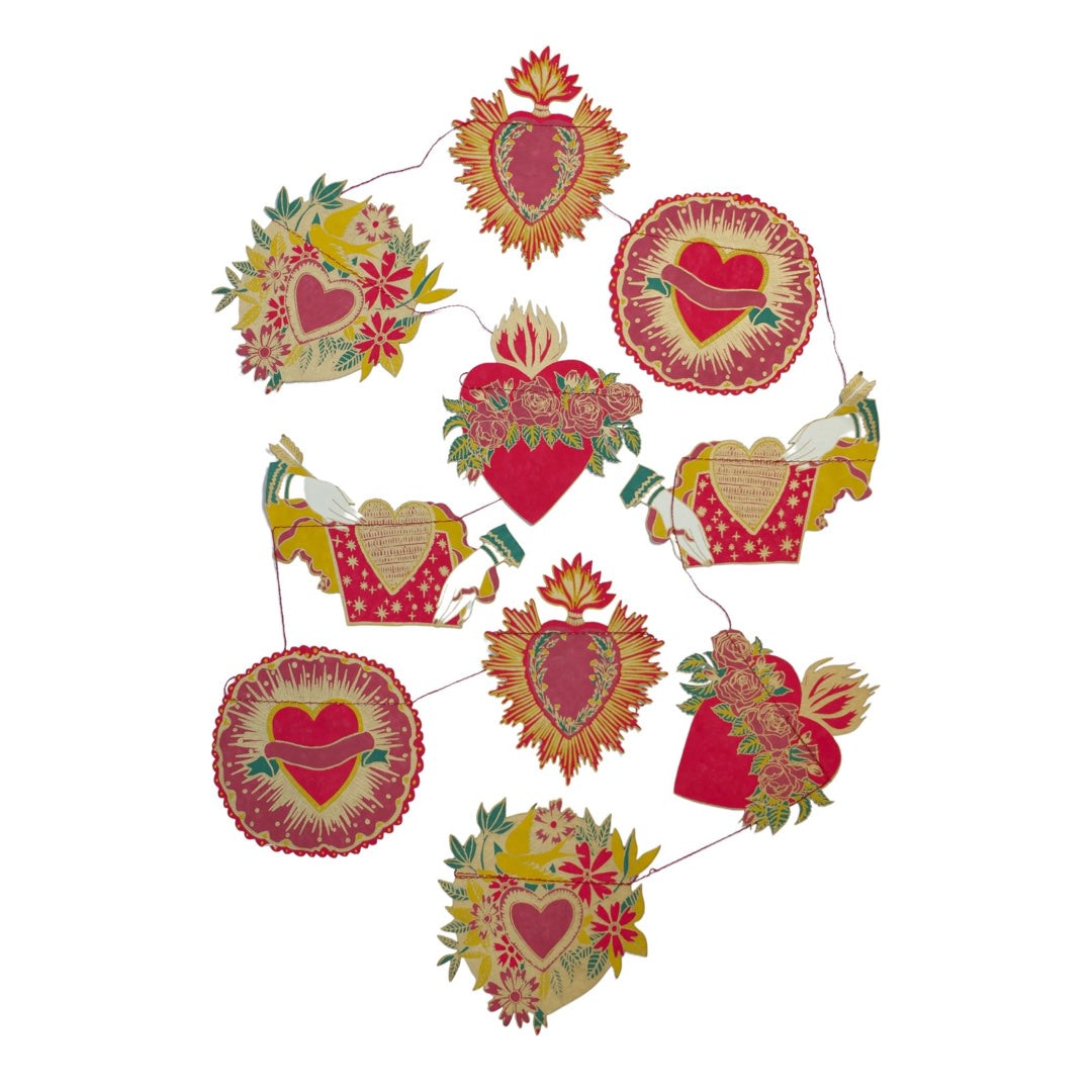 A screen printed paper garland with 10 individual heart designs in red, gold and green.