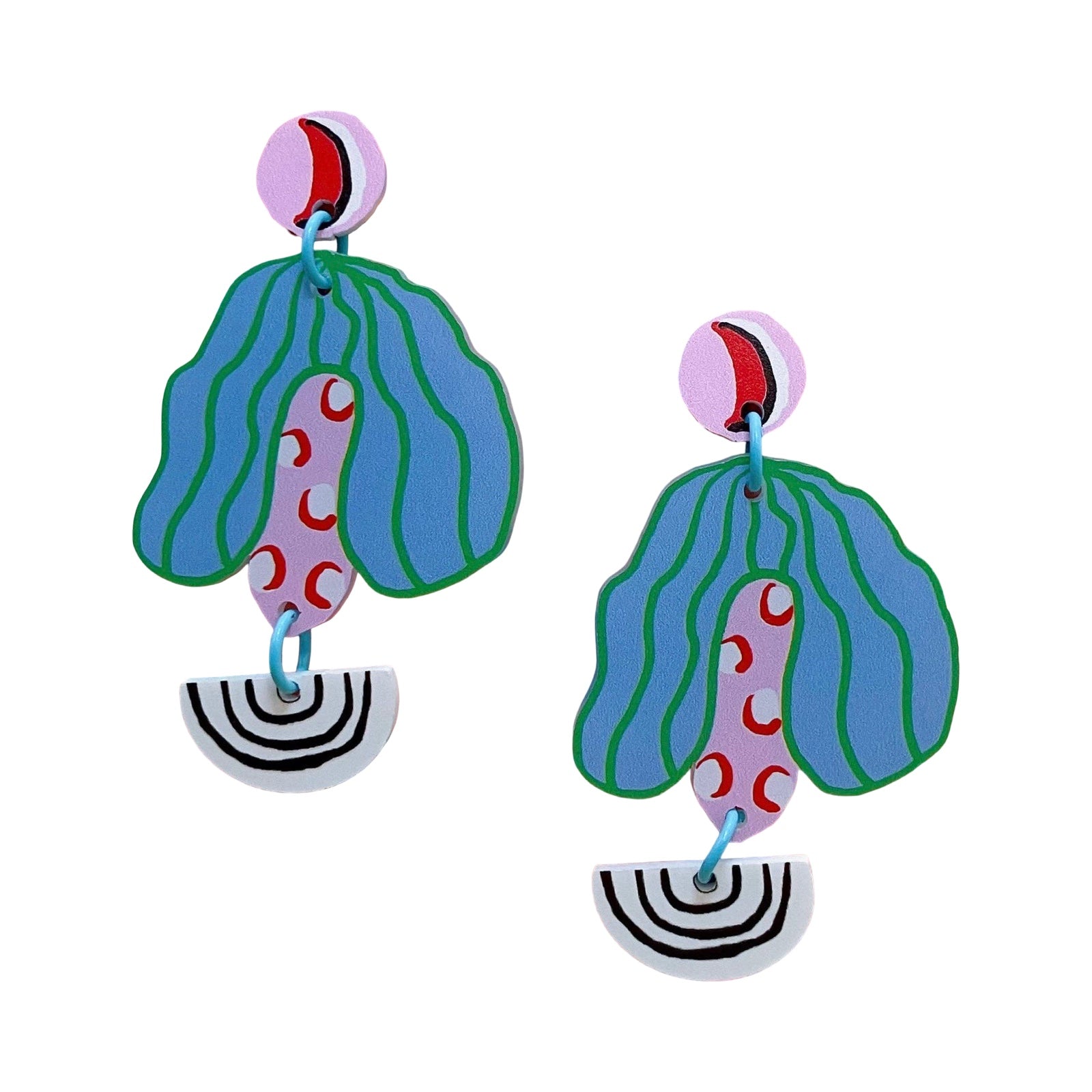 Acrylic earrings with round pink studs, blue and green striped leaves and black and white arcs.