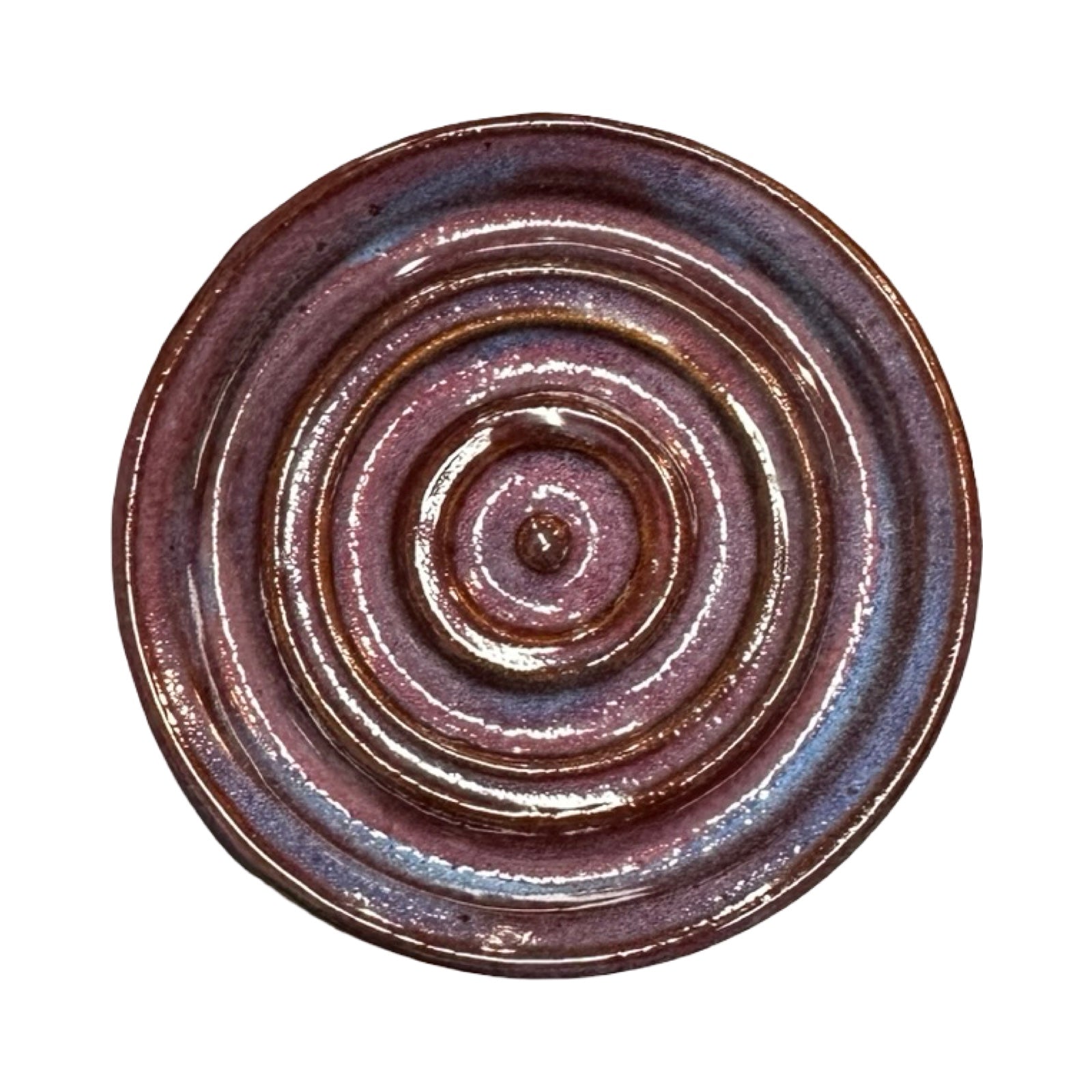 Round ceramic dish with concentric circular pattern on a white background.