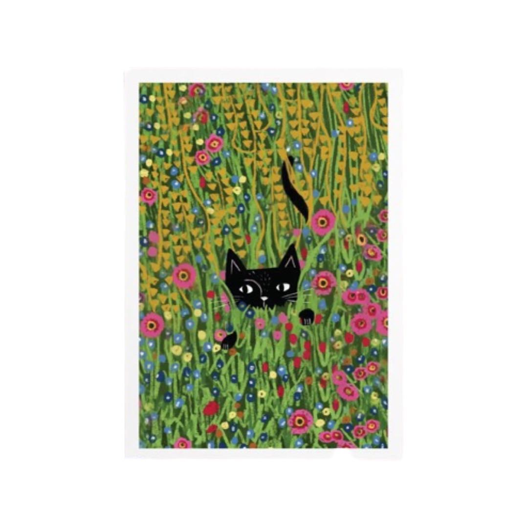 Cat print featuring an illustration of a black cat peeking through the flowers in a meadow, based on the Gustav Klimt painting 'The Flower Garden'.