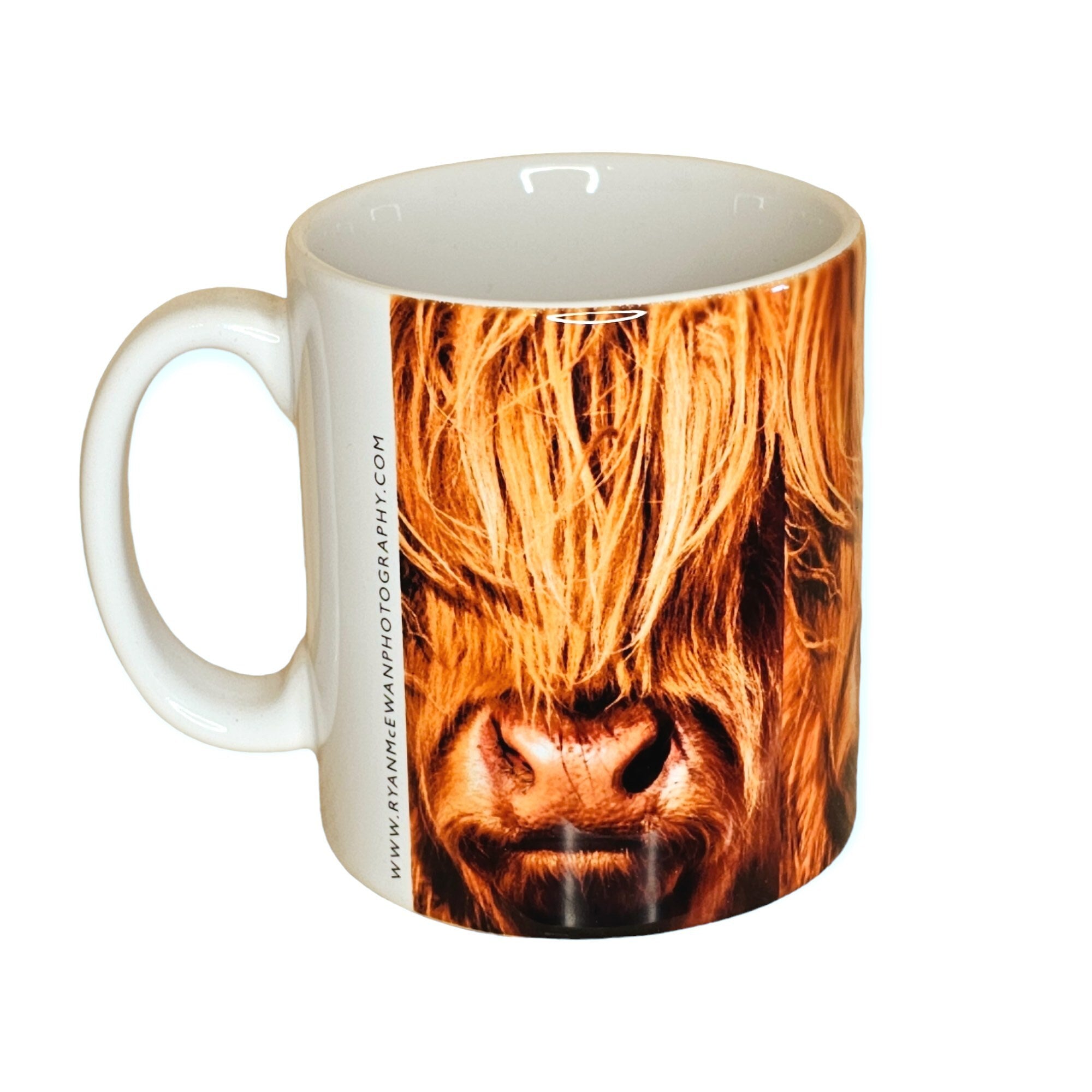 An image of a mug with a Highland Cow on it.