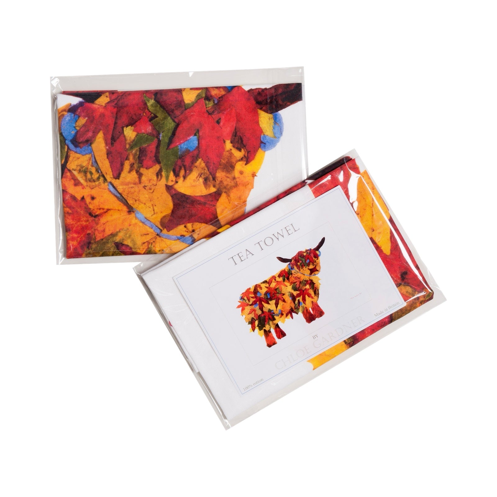 This tea towel features an illustration of a large highland cow in a red, brown and orange leaf design.