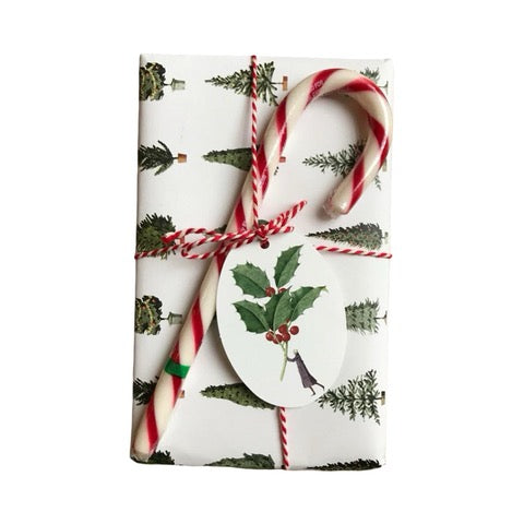 Holly gift tag on a wrapped gift.