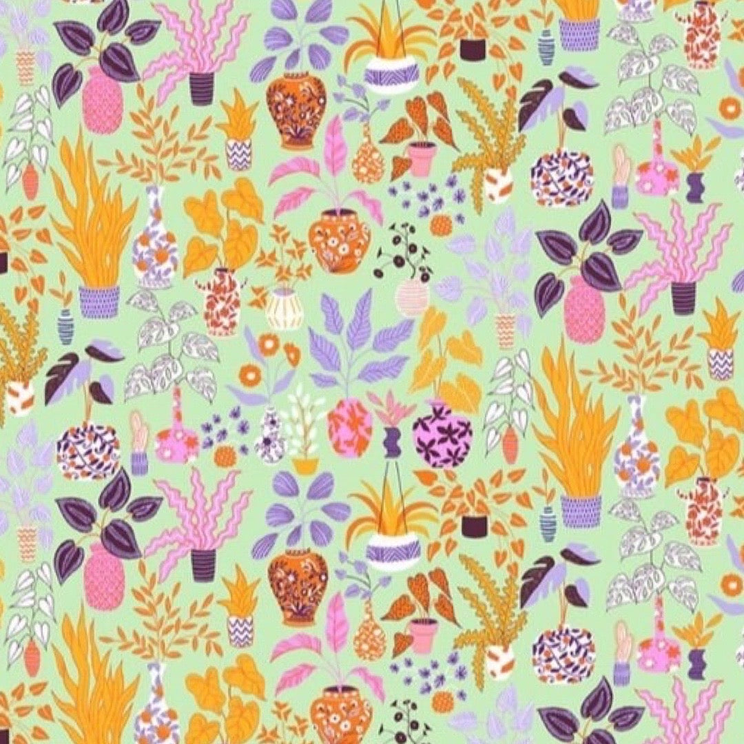Colourful pattern of potted plants on a light green background.