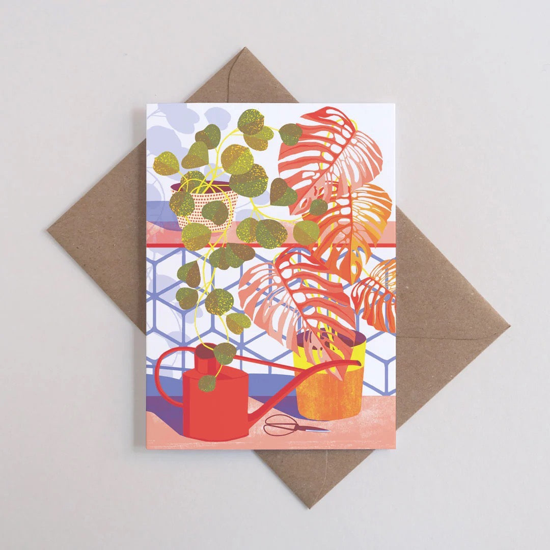 Greeting card with plant illustrations on a brown envelope.