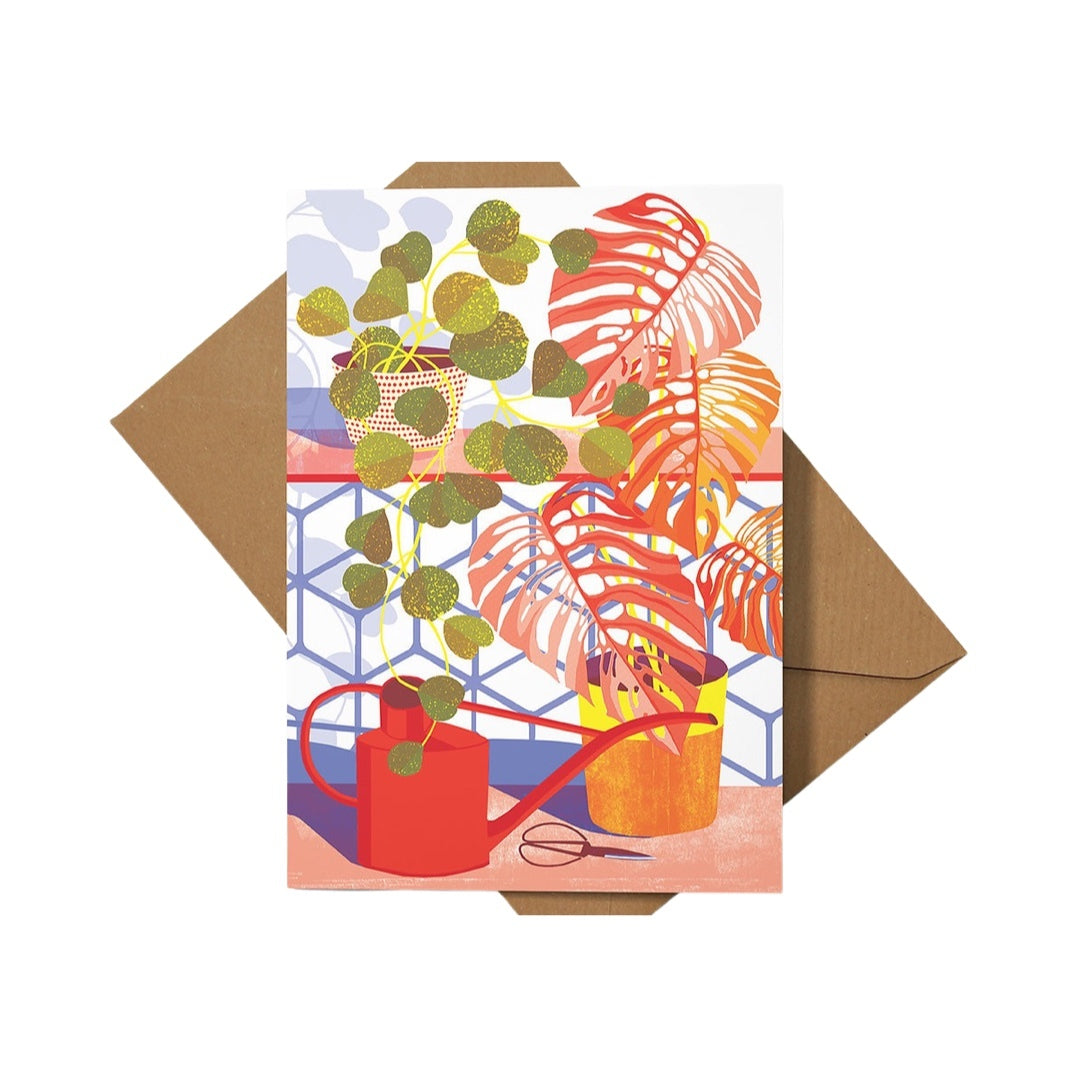 Art card featuring two vases of house plants with red and green leaves and a red watering can.