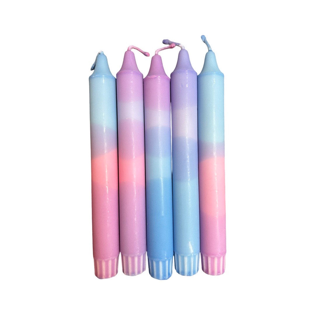 An image of five colourful candles.