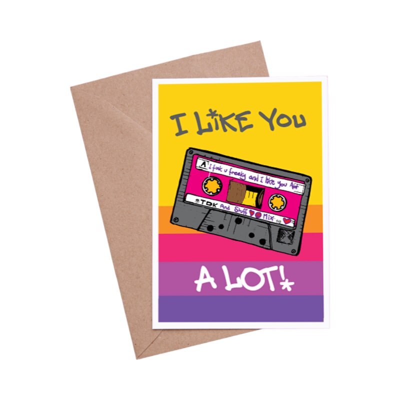 Say how you feel with this mixtape card featuring a grey and pink cassette and the text 'I Like You, A Lot!'.