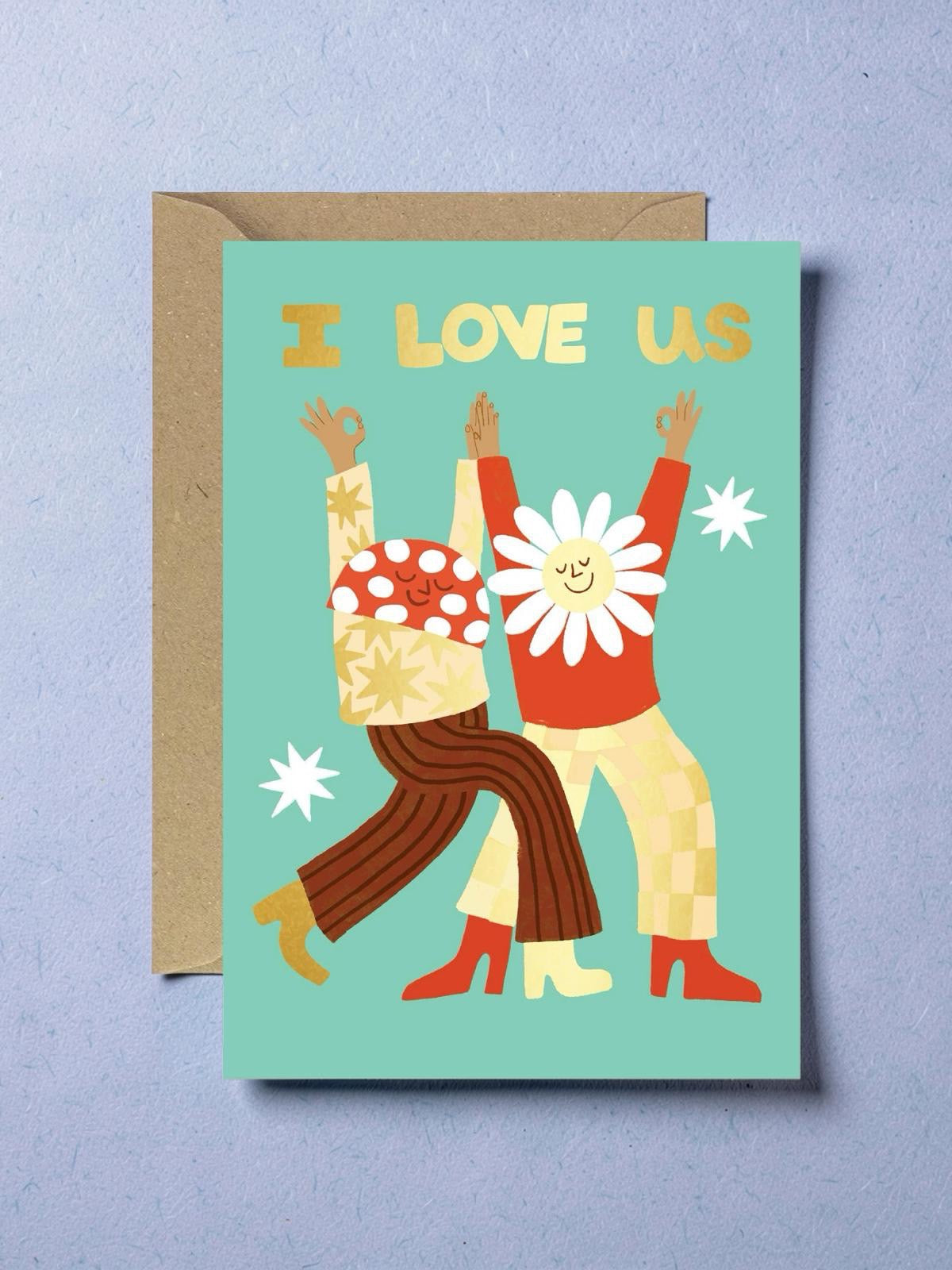 Greeting card with illustration of two people holding hands and 'I Love Us' text on a teal background.