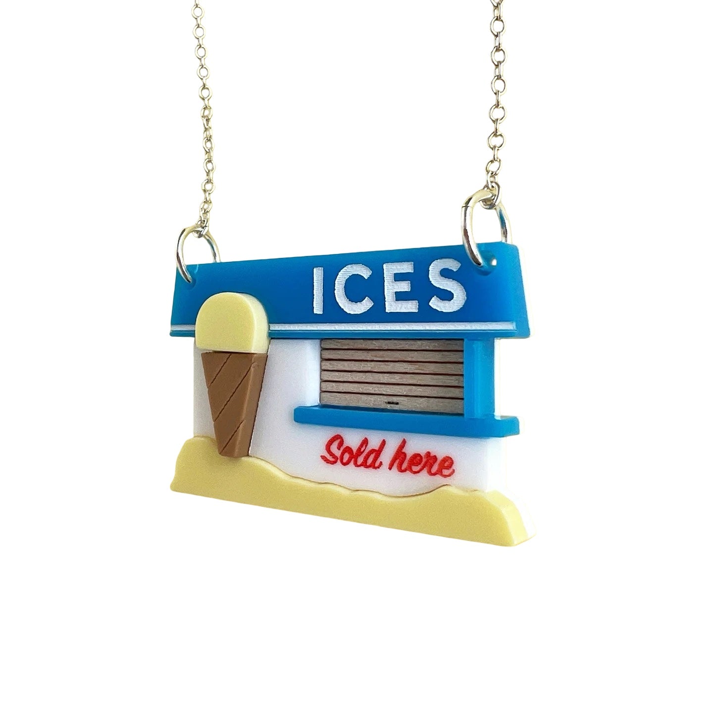 An acrylic necklace featuring a retro-inspired American ice cream kiosk pendant, with a blue roof, grey hatch and a large vanilla ice cream cone outside.