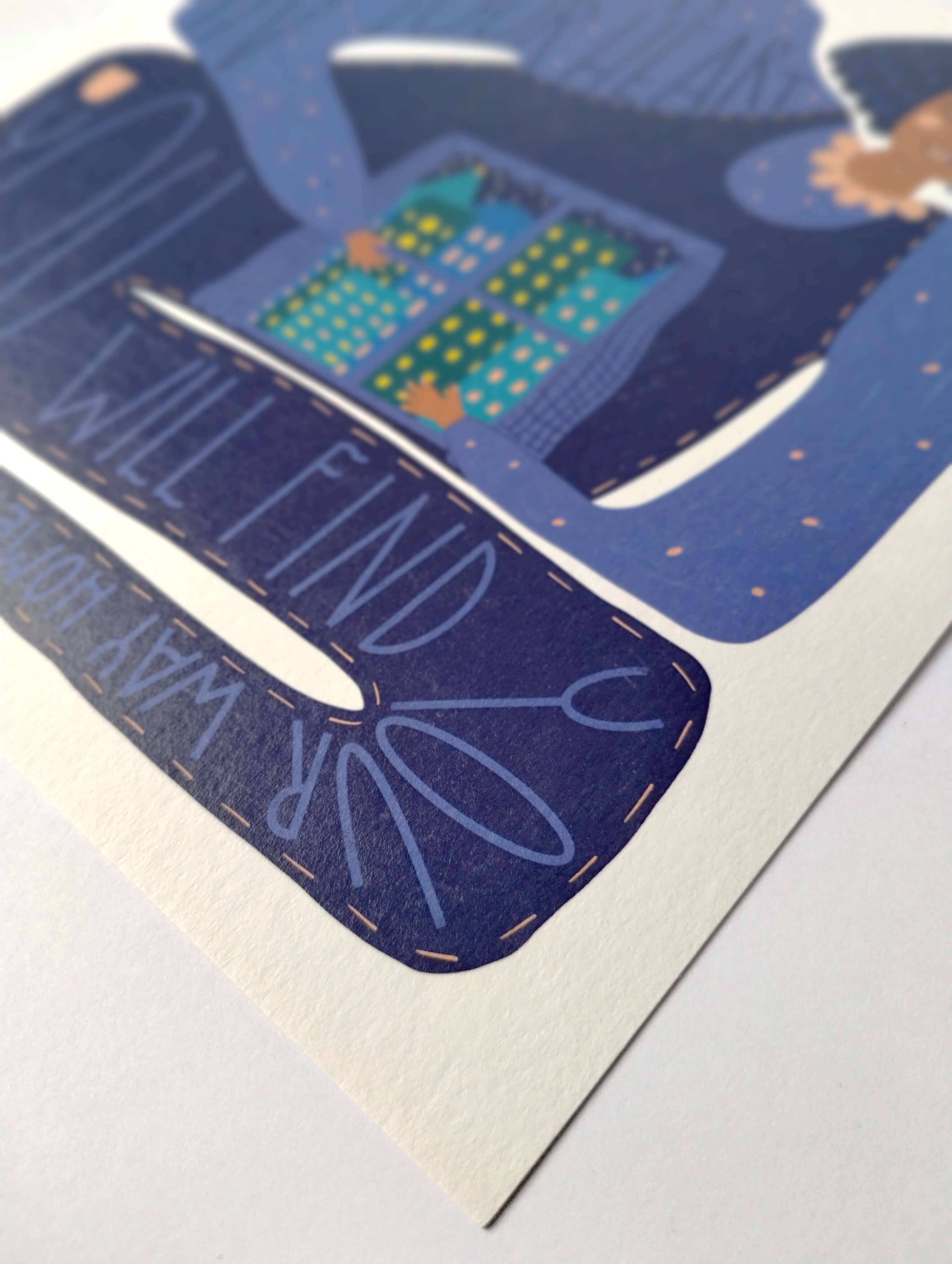 Card with design of a cityscape and motivational text on a blue background.