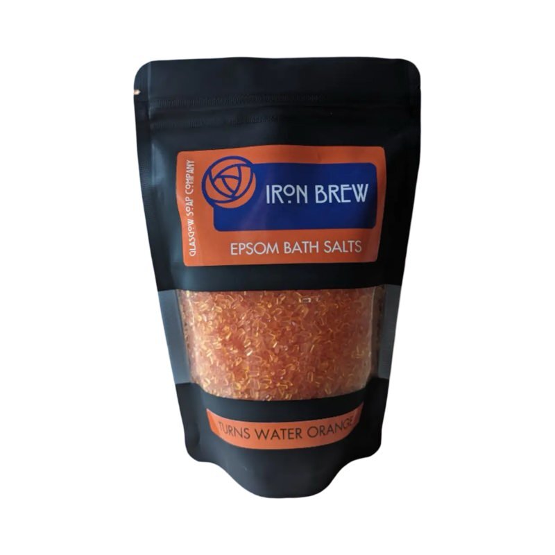A black packet of iron brew fragranced epsom bath salts.
