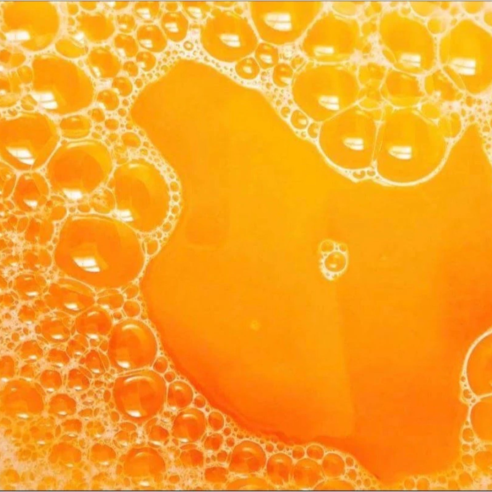 Orange bath water with bubbles