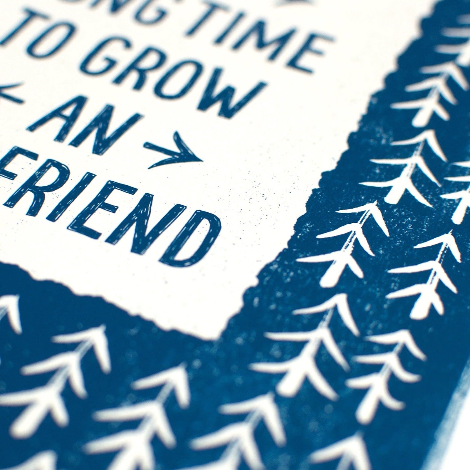 Blue text on a white background with white tree branches.
