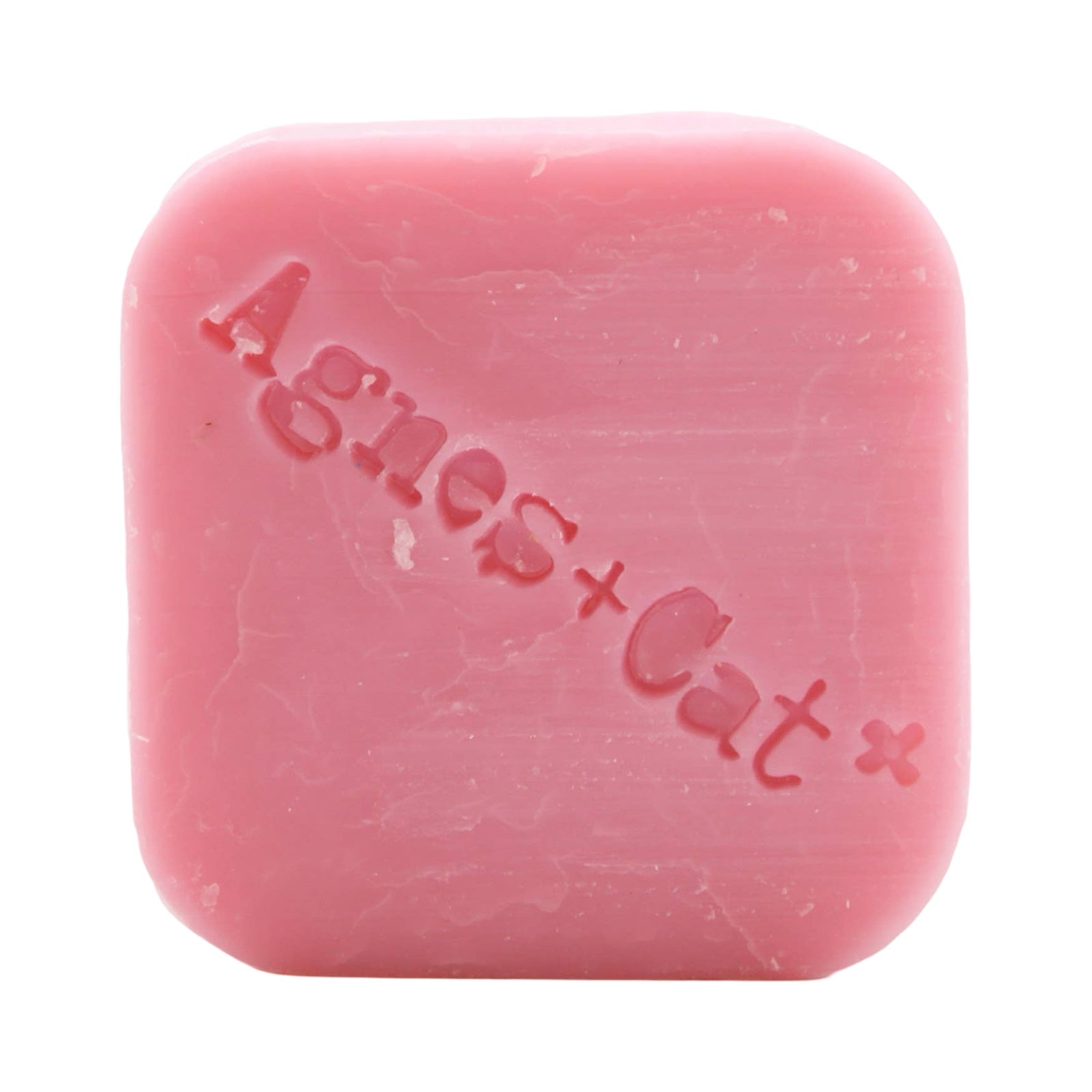 A square-shaped pink, Japanese bloom scented dry shampoo bar