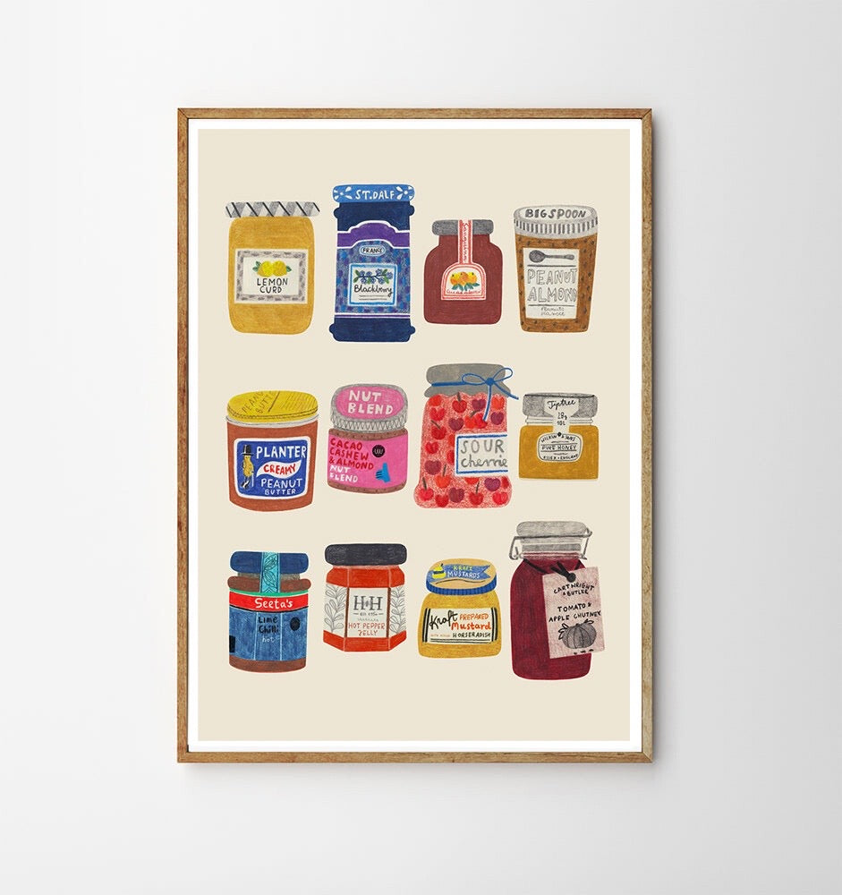 Framed artwork of colorful jam jars on a beige background.