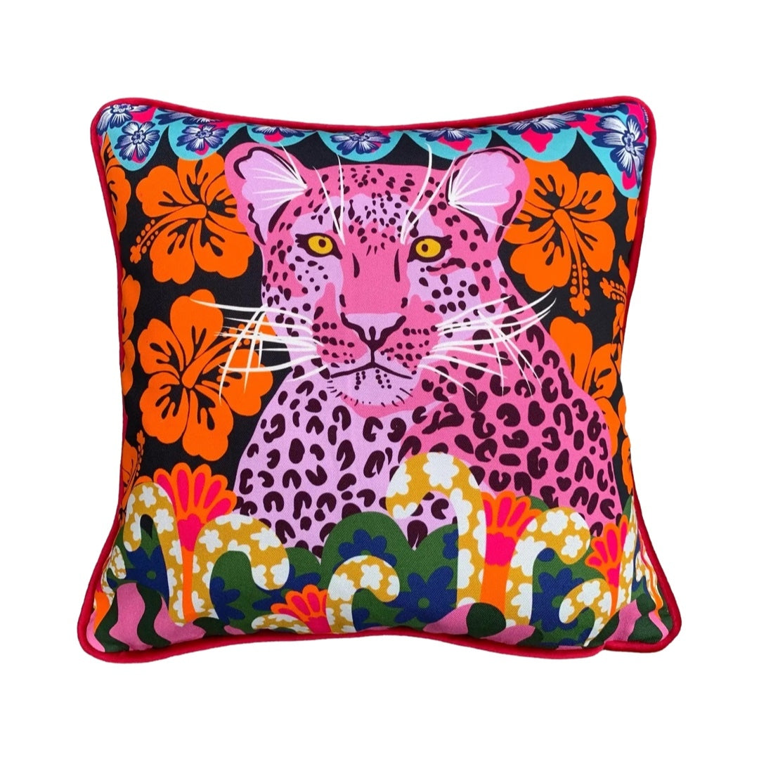 Colourful cushion featuring a beautiful pink tiger, orange flowers and retro inspired borders against a black background.