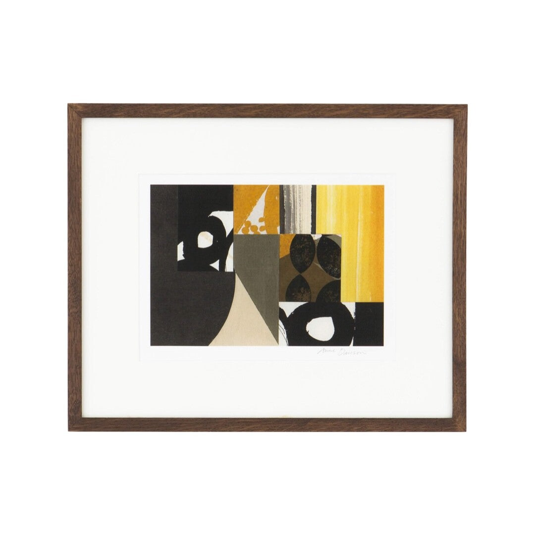 An abstract print featuring geometric shapes in black, brown, and yellow tones, in a brown frame.