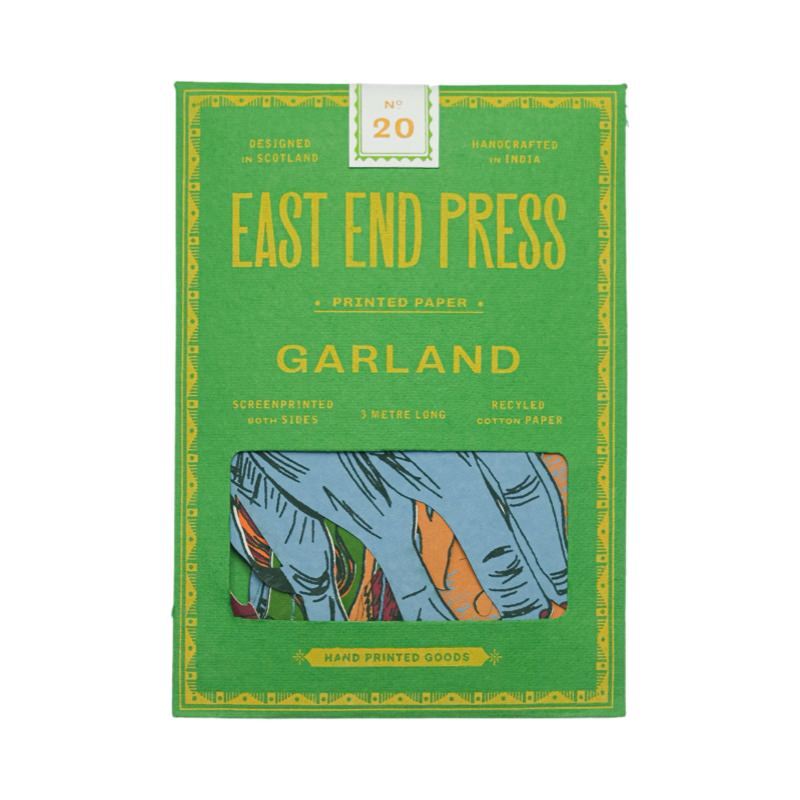 A green paper packet for a jungle paper garland.