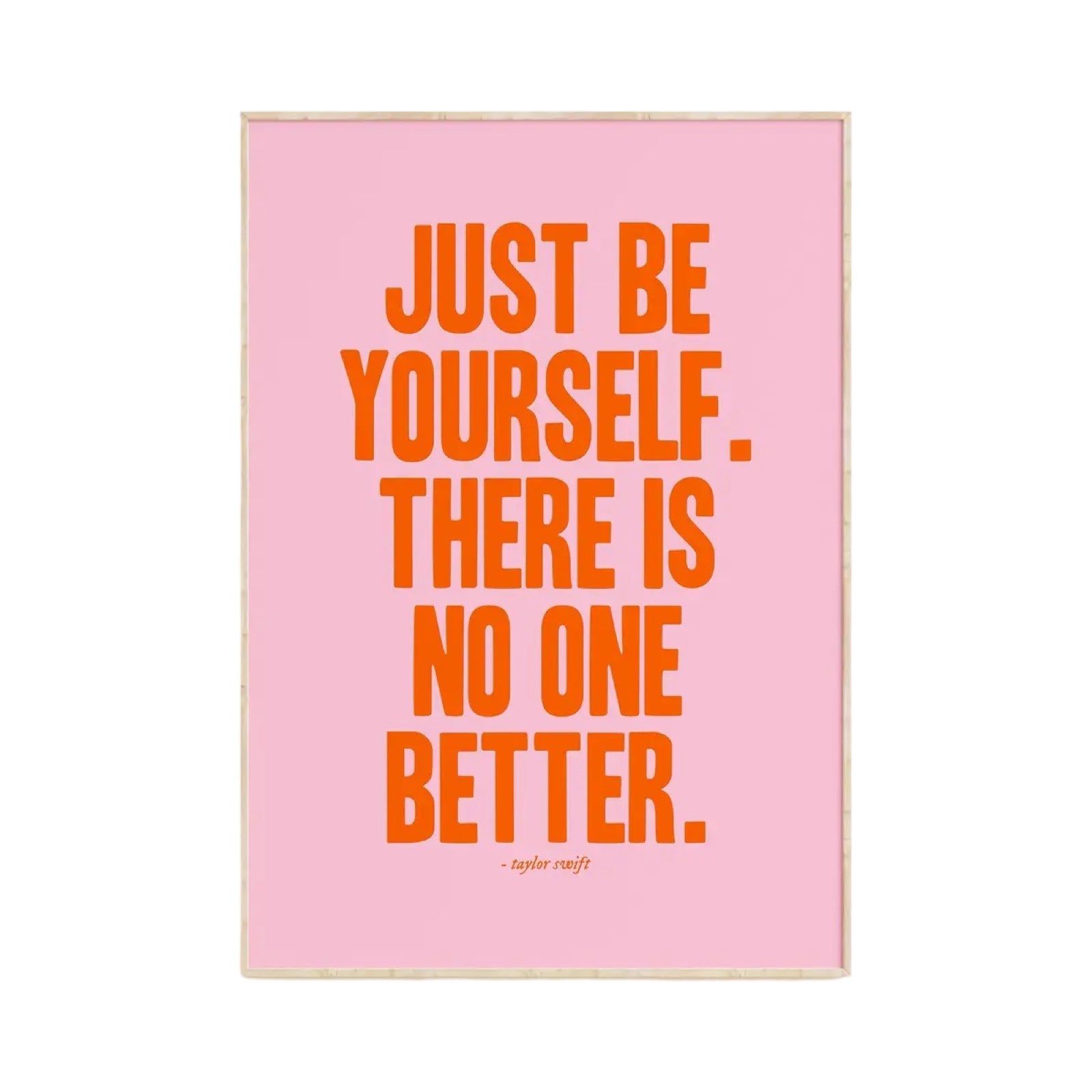 Typography print of the Taylor Swift quote 'Just Be Yourself, There Is No One Better' written in red text against a pink background.