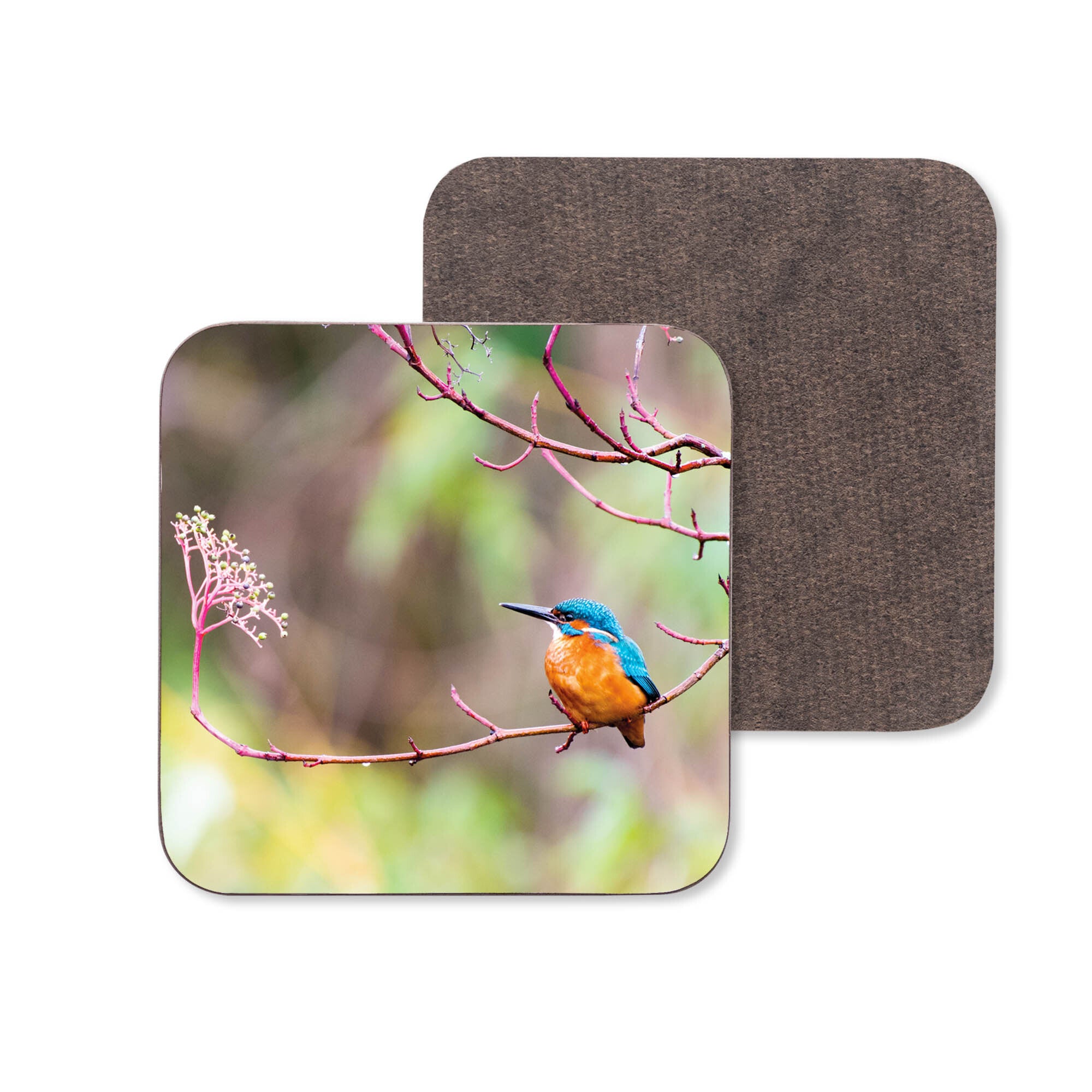 An image of a Kingfisher sitting on a branch on a wooden coaster.